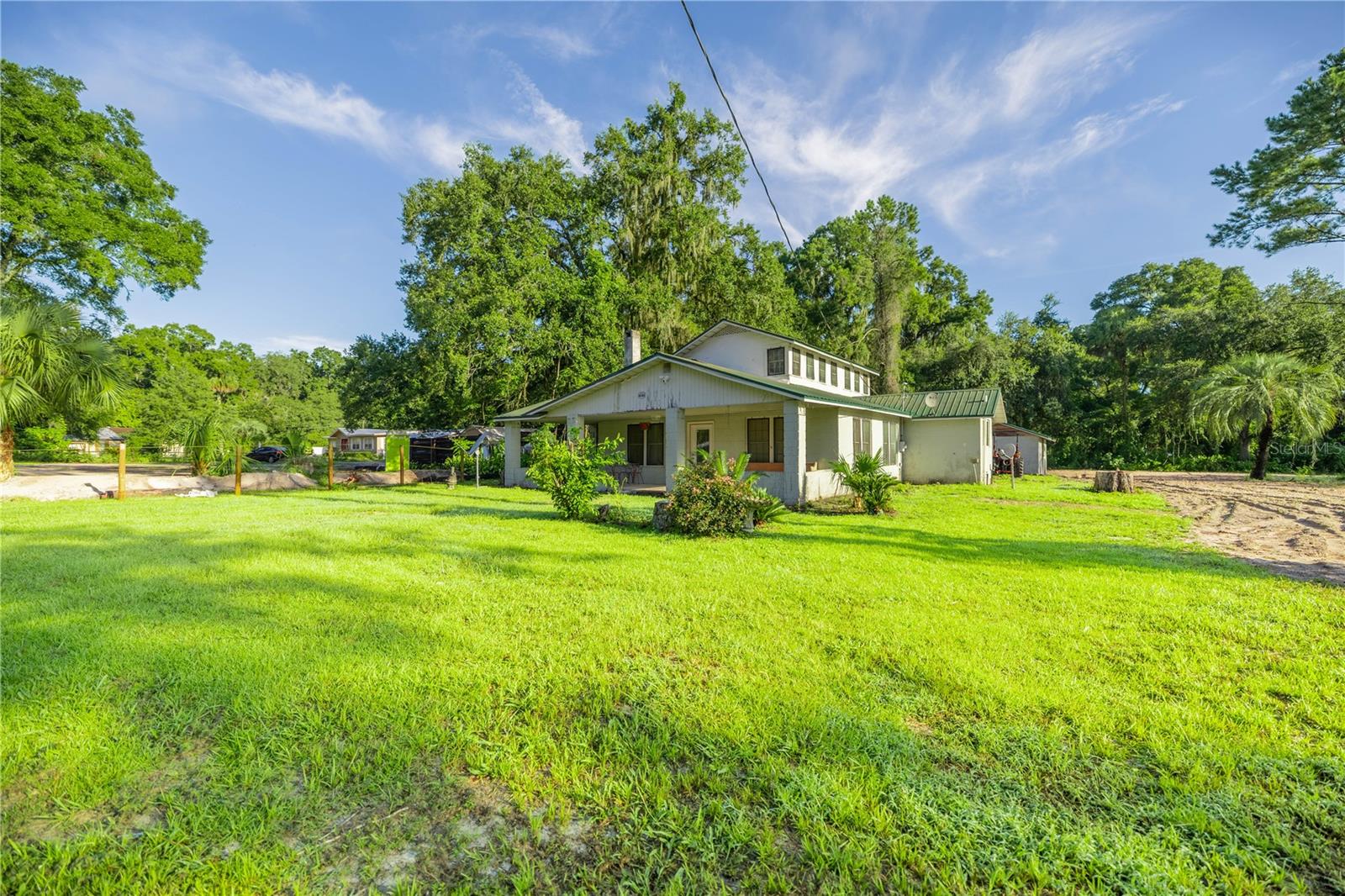 Nestled in the heart of Ocala’s coveted Equestrian community and just minutes from the World Equestrian Center, this delightful 2-acre mini farm offers the perfect blend of rural tranquility and historic charm. Fully cleared and ready for your horses or livestock, the property presents a picturesque setting framed by wide-open skies and peaceful country surroundings. The residence has tons of character, showcasing timeless details that speak to its rich history. Whether you envision a hobby farm, a private equestrian retreat, or simply a serene place to call home, this property offers the flexibility and potential to match your lifestyle.With its prime location near world-class equestrian events, charming downtown Ocala, and beautiful local trails, this mini farm is a rare opportunity to own a slice of history in one of Florida’s most sought-after equestrian communities.