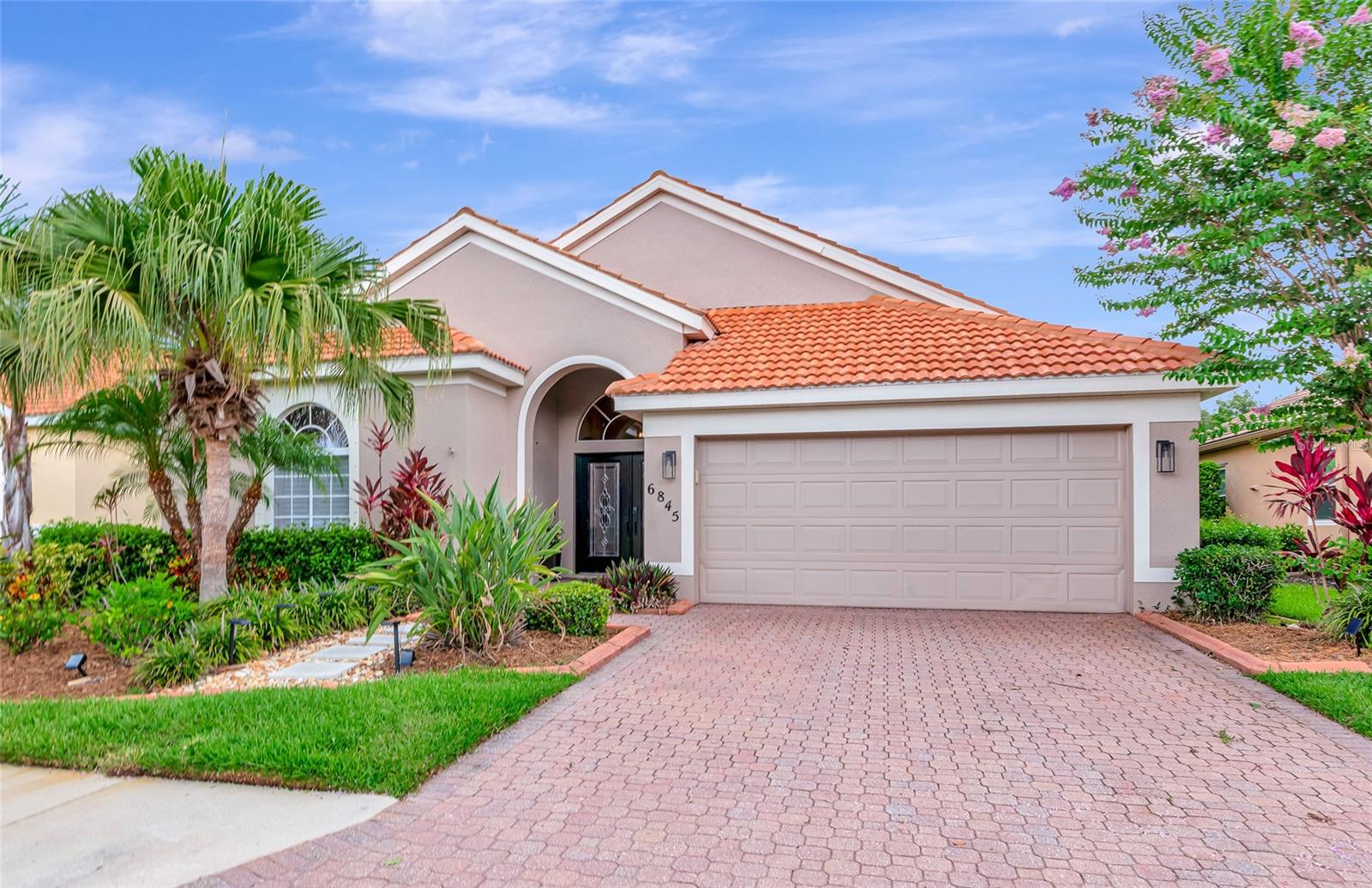 Welcome to River Place, a gated community where comfort meets lifestyle! NO CDD & LOW HOA. This beautifully maintained 3 bedroom plus a den, 2 bathroom home offers a thoughtfully designed split floor plan. Enter through the glass french doors that create a warm and welcoming first impression. and lead into the spacious living area filled with natural light. The kitchen boasts sleek quartz countertops and ample space for cooking and entertaining. The oversized primary suite features dual walk-in closets and a luxurious en-suite bath complete with dual vanities, a soaking tub, and a walk-in shower. Step outside and experience the ultimate in outdoor living! This home features a spacious, screened-in patio—perfect for morning coffee, weekend barbecues, or winding down in the evening while enjoying the peaceful surroundings. With plenty of room for lounge seating and dining, it’s an ideal space for entertaining or simply soaking in the Florida sunshine without the hassle of bugs. Beyond your private oasis, River Place offers even more ways to enjoy the outdoors. Paddle out from the private kayak launch and explore the scenic river, take a stroll through the beautifully maintained neighborhood, or relax at the community pool. Whether you're hosting guests or enjoying quiet time in nature, this home invites you to embrace the indoor-outdoor lifestyle year-round. River Place residents enjoy resort-style amenities including a community pool, playground, fitness center, clubhouse, and a kayak launch to the river—ideal for nature lovers and active lifestyles. Don’t miss the opportunity to live in one of the area’s most desirable communities!