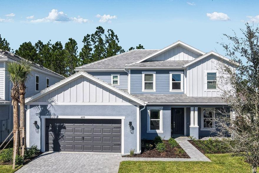 What's Special: 1st Floor Primary Suite | Extended Patio | Dedicated Study. New Construction – Ready Now! Built by Taylor Morrison, America’s Most Trusted Homebuilder. Welcome to the Sand Key at 1699 Trailhead Lane in Hammock at Two Rivers! Welcome home to a charming covered porch and a warm, light-filled foyer. A formal dining room, private study, and nearby half bath create a thoughtful layout near the garage entry. The kitchen connects seamlessly to the great room and casual dining area, with a walk-in pantry to keep essentials tucked away. Sliding glass doors lead to a covered lanai—perfect for relaxed outdoor gatherings. The downstairs primary suite offers a peaceful retreat with a spa-inspired bath and spacious walk-in closet. Upstairs, four bedrooms surround a large game room. Two feature private baths and walk-in closets, while the others share a dual-sink bath for easy mornings. Step into the Hammock at Two Rivers, a private resort-style club offering elevated everyday living. Enjoy a premier health club, racquet sports, and a spectacular pool. Dine with neighbors at the planned fine dining restaurant or unwind at the poolside bar. Future amenities include a playground, lap pool, event lawn, and slide tower. Located in Zephyrhills, this vibrant area blends small-town charm with big-city access—close to shopping, dining, top schools, and major attractions in Tampa and Orlando. Beaches like Sunset and Clearwater are just a short drive away. Additional Highlights Include: Tray ceiling at great room, primary suite/dining room/study/game room, pocket sliding glass door at primary suite, gourmet kitchen, 8' interior doors, covered extended lanai, study in place of flex, and outdoor kitchen rough-in.  MLS#TB8430598