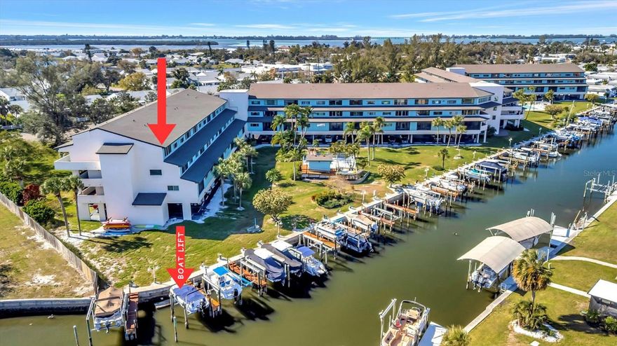 Welcome to the transformed Waterway Condominiums, where cheerful coastal living meets thoughtful design and effortless boating access. This 3-bedroom, 3-bathroom turnkey end-unit has been extensively restructured following storm improvements and now showcases high-end finishes and modern upgrades throughout, creating a move-in-ready opportunity in one of West Bradenton’s most desirable waterfront communities.

Step inside to discover a bright, open layout enhanced by new luxury vinyl plank (LVP) flooring, fresh interior paint, and stylish ceiling fans. The updated interior features custom closets, extra insulated storage, and a well-equipped laundry room with a convenient wash basin. Designed for comfort and flexibility, the home also includes a Murphy bed, neutral coastal décor, and multiple dining and gathering spaces with a dining table, breakfast bar, and ample seating for entertaining.

Positioned as a premium end unit, this residence captures stunning canal and Palma Sola Bay views, where daily sightings of manatees, birds, and abundant Florida wildlife create a truly serene waterfront backdrop.

For boating enthusiasts, this property is a rare find—complete with a deeded boat slip and lift, offering access to open water. Enjoy exploring nearby sandbars, world-class fishing, island hopping, and popular waterfront dining destinations—making this an absolute boater’s dream lifestyle.

The Waterway Condominiums community offers a wide array of amenities, including a heated pool, spa, fitness center, grills, clubhouse, billiards room, ping pong, and tennis courts, all designed to support an active and social coastal lifestyle. The association fees cover nearly everything except electric, providing exceptional value and simplified ownership.

Ideally located with the pristine beaches of Anna Maria Island—less than 3 miles away—you’ll enjoy easy access to sugary sands, turquoise waters, and a vibrant selection of local restaurants, shopping, and entertainment even closer to home.

Whether you're seeking a full-time residence, seasonal retreat, or investment opportunity, this beautifully upgraded waterfront condo delivers the best of Florida coastal living, boating convenience, and low-maintenance ownership.