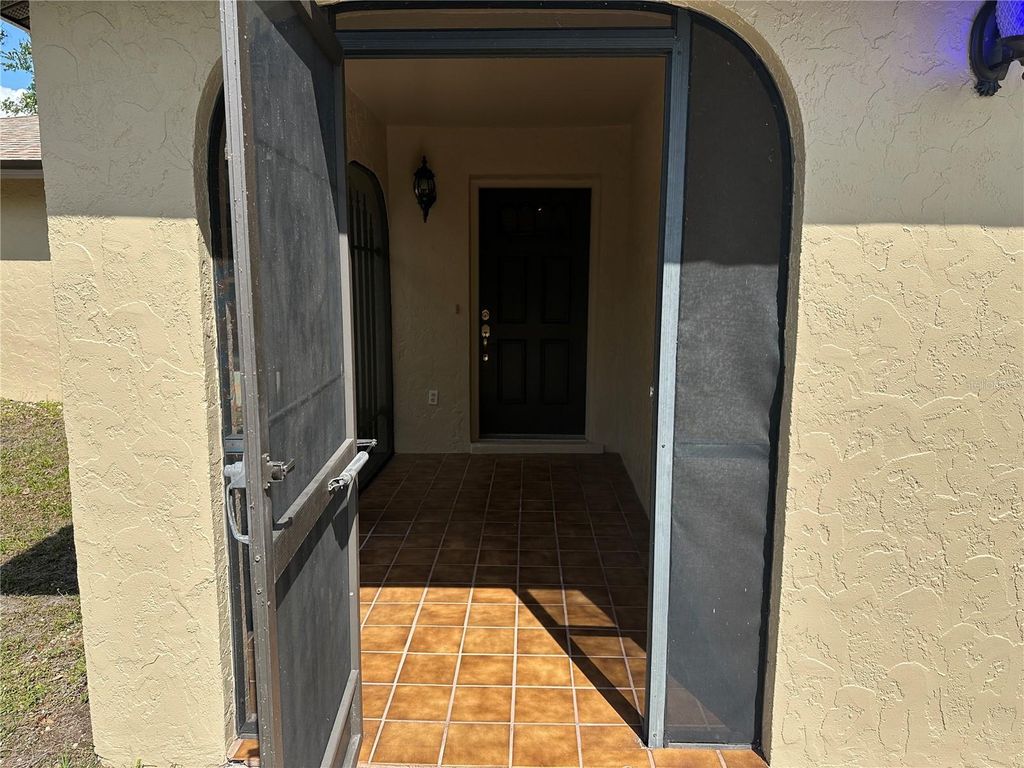 Photo of 1022 Waterside Street, Port Charlotte, FL 33952 (MLS # C7507748)