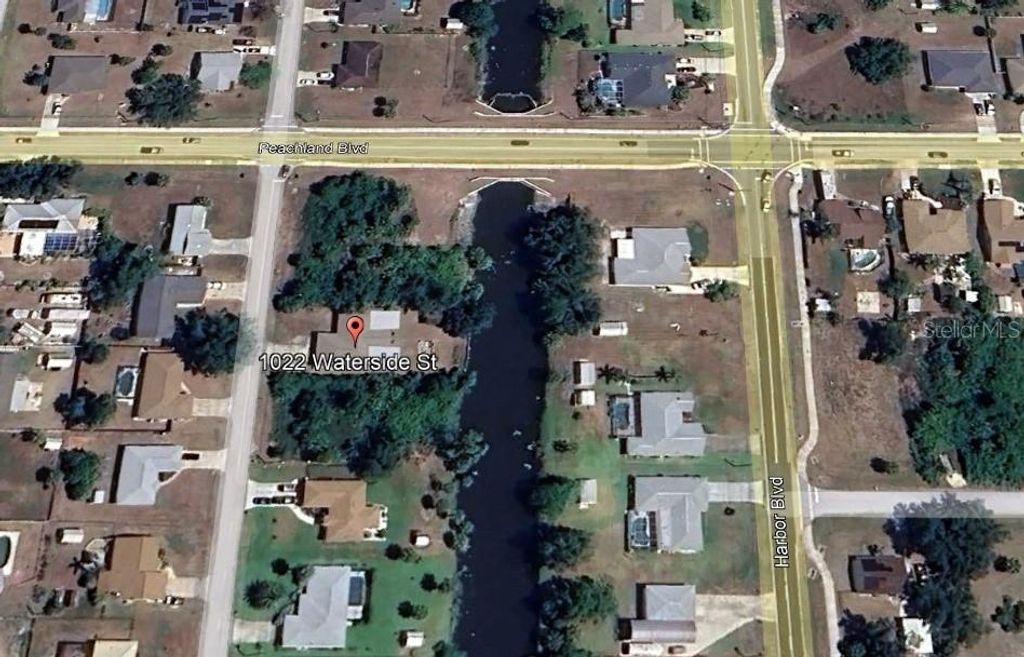 Photo of 1022 Waterside Street, Port Charlotte, FL 33952 (MLS # C7507748)