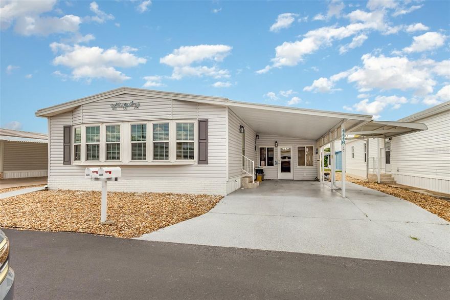 Walk right into this beautifully updated and maintained home.  Walk right in to see the updated family room featuring a newly installed fireplace and updated kitchen.  The flooring in these areas have been replaced with a very attractive vinyl.  The area is open and airy and perfect for entertaining.  From the kitchen is a nice dining area with an updated built-in.  The living room features cathedral ceilings and a spacious bay window.  Each bedroom has it's own attached bath, perfect for visitors.  The primary bedroom has an escape door into the shed offering a third point of entry to the home.  The vinyl thermal windows provide extra insulation value.  This home comes furnished with what you see in the home.  Oakwood Estates, a 55+ resident owned community, offers many amenities and activities.  Make your appointment today to view this amazing home!!