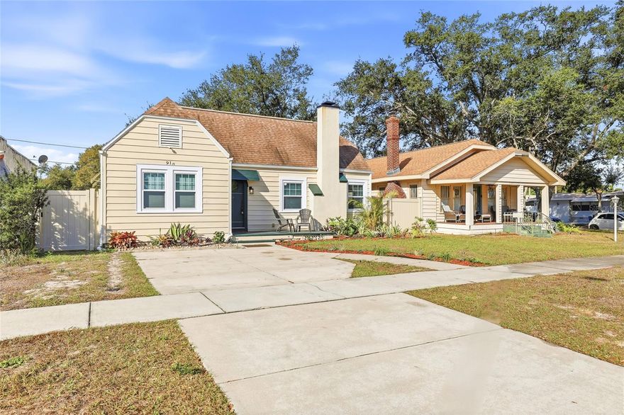 A rare opportunity to own a historic 1920s gem in Central Oak Park, this beautifully renovated St. Petersburg residence blends glamorous period charm with modern comfort throughout its thoughtfully designed, move-in-ready spaces. Step through the lovingly restored arched original wood front door into a true entry hall.  Step down into the living room with soaring ten-foot ceilings where an original tile fireplace immediately conveys the elegance of the era, while contemporary updates ensure effortless turn-key living. Whether hosting a formal dinner party or casual gathering, the seamless flow between the dedicated dining room and updated kitchen with convenient bar-top seating makes entertaining a pleasure, while the remodeled kitchen delivers the simplicity and functionality today’s buyers expect. The spacious primary bedroom serves as a private retreat and features a brand-new ensuite bathroom, while the updated hall bath showcases charming tilework that honors the home’s historic character. Both the front bedroom and primary suite are thoughtfully positioned away from the main living areas, providing comfort and privacy for residents and guests alike. Additional highlights include interior laundry with flex space adjacent to kitchen, alley-access garage, back yard ready to transform into your Florida oasis, and a layout that supports easy everyday living. Located in the sought-after Central Oak Park neighborhood of St. Petersburg, this home is just minutes from downtown, vibrant dining and nightlife, the Gulf beaches, and the eclectic shops and restaurants of the nearby Grand Central District, with the SunRunner express bus providing easy access throughout the city. This historic St. Petersburg home for sale offers timeless charm, modern upgrades, and an exceptional location. Schedule your private showing today!