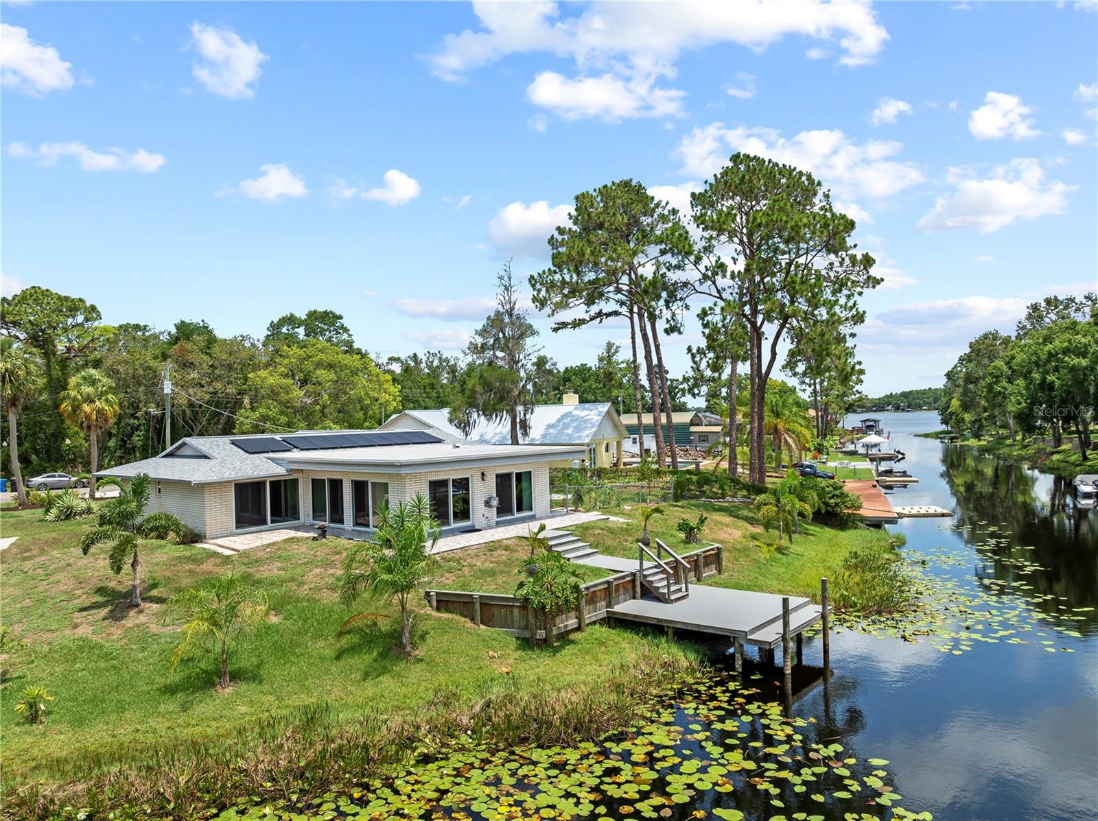 Bring your Boats and Toys!!!! Live the lake life with this rare rental opportunity just 500 feet from Keystone Lake, one of the largest and most desirable spring-fed lakes in Northwest Hillsborough County. Situated on nearly half an acre with 200 feet of private canal frontage, this home offers direct access to the lake with a private dock and boat ramp—ideal for boating, paddleboarding, and fishing. Located in the highly rated school zones of Hammond Elementary, Martinez Middle, and Steinbrenner High, it’s perfect for families seeking both quality education and a peaceful setting. The home features durable block construction at the back, energy-efficient solar panels with battery backup to help reduce utility costs, hurricane-rated windows for comfort and safety, and a remodeled kitchen with solid wood cabinets and porcelain tile throughout. Enjoy the tranquility of the upscale Lakes of Keystone neighborhood, just minutes from shopping, dining, Tampa International Airport, and less than 40 minutes to the beaches. Pets may be considered at the owner’s discretion. This home offers a unique blend of natural beauty, top schools, and urban convenience—ideal for renters looking for more than just a place to stay.