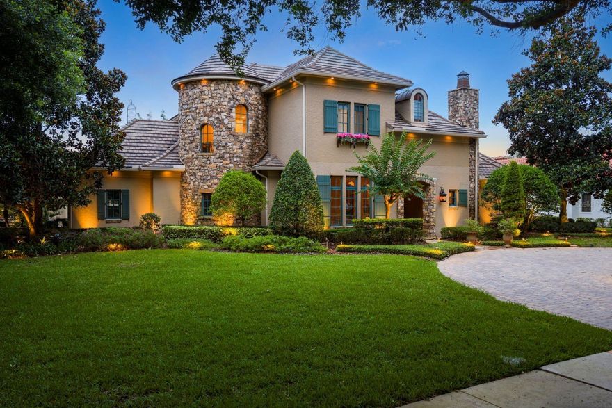 A one-of-a-kind French Provincial estate, "The Monet," was crafted by Master Custom Builder Castleworks in 2008 and has been updated a smart home for today’s buyers. This luxurious residence is situated on a rare corner lot within the prestigious gated community of The Reserve at Lake Butler Sound, featuring a 24-hour manned entrance, picturesque English garden parks, a lakeside gazebo, and a waterscape entry, promising an exclusive lifestyle of elegance and tranquility. The home features a front circular drive along with an additional side-entry driveway providing access to the two attached garages. 
Upon entering the loggia with groin ceiling, the home unfolds into an arched gallery and custom solid wood doors welcome you to the private study offering a stone fireplace and views extending to the covered terrace and open-air pool surrounded by lush tropical landscaping. The interior is adorned with exquisite details, from crown moldings to intricate coffered ceilings, polished stone floors, and stunning millwork.
The heart of the home is the gourmet kitchen, a haven for culinary enthusiasts, equipped with a center island, custom cabinetry, and high-end Wolf and Sub-Zero appliances, including a six-burner gas range. The kitchen seamlessly flows into the family dining area and spacious great room, where French doors offer panoramic views of the crystal blue pool.
The covered lanai, nestled within the colorful landscape, is a perfect retreat featuring a cozy fireplace and a well-appointed summer kitchen. From the owner's retreat vestibule, enter the intimate master suite, which opens to the covered terrace through double French doors. The opulent master bath is a sanctuary, boasting a whirlpool bath, walk-through shower, and a spacious wardrobe room.
Completing the main level are a brick-lined wine cellar and the versatile fifth-bedroom suite with a full bath and walk-in closet. Ascend the dramatic stairway to the second-floor game loft, featuring custom built-in cabinetry, along with three additional bedroom suites, each with a private bath and walk-in closet. A secondary washer and dryer round out the features of the second floor. 
This residence is perfected with a side-entry driveway accessing the 2-car and 1-car garages, framed by a private brick paver motor courtyard. Completing the resort feel, the property offers a magnificent saltwater pool with a heated spa, surrounded by custom landscaped grounds. Experience the unparalleled luxury and timeless elegance of "The Monet," where every detail has been meticulously curated to offer a lifestyle of distinction and sophistication.