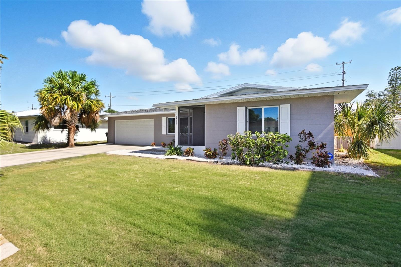 Welcome home! Priced to Sell and Move In Ready! Welcome to this beautifully maintained 3-bedroom, 2-bathroom home with an oversized 2 car garage in a desirable, family-friendly neighborhood with no HOA or deed restrictions. With its thoughtful updates and inviting features, this property is truly move-in ready. Step inside to find a freshly painted interior and tile flooring throughout. The kitchen is bright and functional with stainless steel appliances, granite countertops, and plenty of cabinet space for all your cooking essentials. Both bathrooms are well-kept, and the home has been lovingly cared for over the years. The open living area flows nicely to the large covered lanai, perfect for family gatherings, barbecues, or simply relaxing while the kids or pets play in the fully fenced backyard. The master suite offers a spacious bedroom, a large walk-in closet, and a private bathroom. You’ll also appreciate the new ceiling fans and light fixtures that add a fresh, modern touch throughout the home. Outside, there’s plenty of space for hobbies and storage with the oversized 2-car garage featuring built-in cabinetry and a storage shed in the backyard. This home has it all—modern updates, low-maintenance features, and a welcoming neighborhood setting. There’s truly nothing left to do but move in and start making memories.
