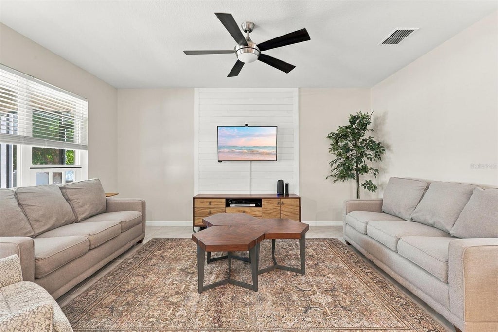 Photo of 704 Red Hawk Lane, Deltona, FL 32725 (MLS # O6453470)