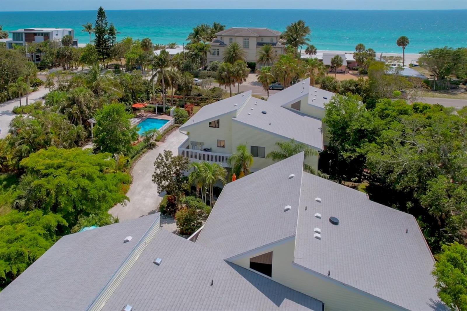 NOW AVAILABLE FOR THE 2026 SEASON: Take a 60 second stroll across the street to the Gulf Beach from this Very Popular and Beautiful Renovated unit with an onsite heated pool and outdoor shower. Enjoy Peek-a-views of the gulf beach right from the Living Room Sofa, or Brand New Private Wrap Around Balcony to enjoy sunsets that are truly amazing! There's truly Nothing else like it on the island. Located just 2 blocks from Publix shopping center along with beach access just across the street. Just bring your personal belongings as everything is included and right here awaiting your arrival. From new sheets, towels, top of the line Comforters, bikes, beach chairs & cady, board games, books, bidet toilets, beautiful electric fireplace, all kitchenware & gadgets, large screen smart tv's in every room, high speed internet, printer, and a ton more. You also have 2 parking spaces, a storage area as well as guest parking. You will surely love it here! Hurry Before It's Gone! References and reviews available if desired.