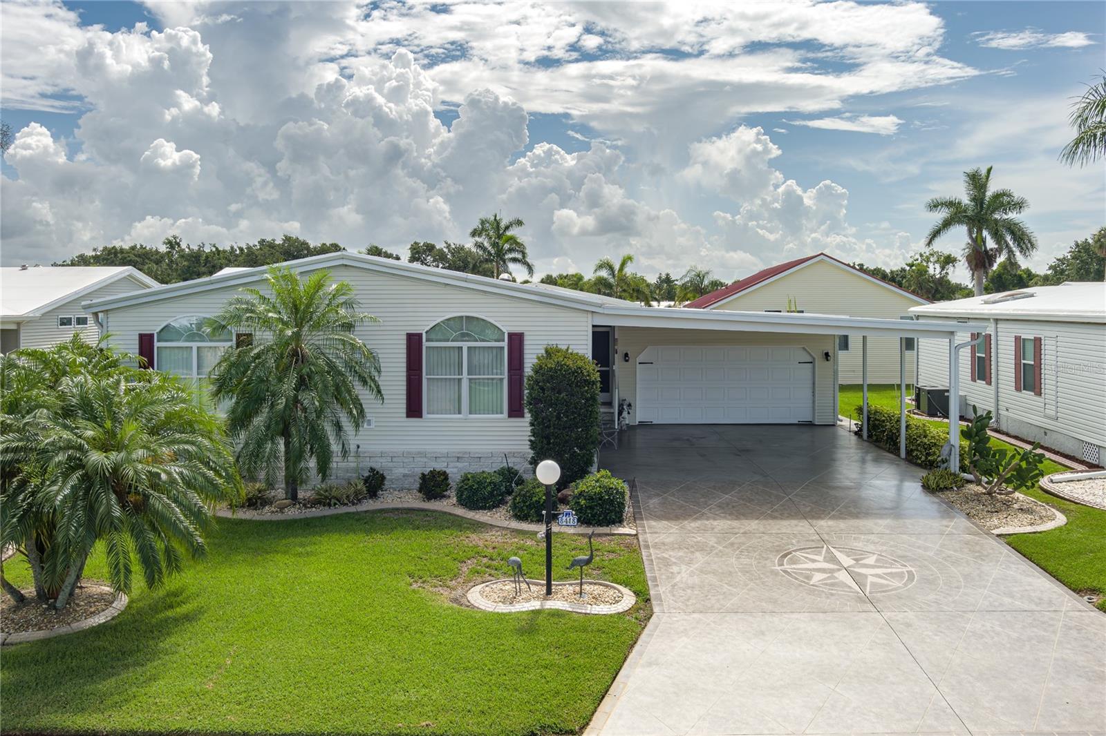 Don’t miss this opportunity to enjoy comfort and style in the highly desirable 55+ community of Imperial Lakes Estates. This beautifully maintained 3-bedroom, 2-bathroom home is move-in ready and features a spacious 2-car extended garage plus a 2-car carport, providing ample room for vehicles, a golf cart, or additional storage. Inside, you’ll find a bright and open living space with elegant triple tray ceilings and a smart layout that makes daily living easy. The galley-style kitchen includes a cheerful breakfast nook, ideal for casual meals or morning coffee. The generous owner’s suite offers a peaceful retreat with a private bath and large closet space. Additional highlights include an indoor laundry room and abundant storage throughout the home. Step out to your private screened lanai, perfect for enjoying peaceful mornings or winding down in the evening. Recent updates include a new roof installed in 2020, a new AC installed in 2018 and updated flooring, ensuring comfort and value. Imperial Lakes Estates offers resort-style amenities such as two heated pools, a spa, pickleball courts, shuffleboard, bocce, and horseshoes. The active clubhouse features a library, a game room with pool tables, and a wide variety of social activities to enjoy. Conveniently located close to shopping, dining, and with easy access to I-75, this furnished home is ready for you to settle in and embrace the Florida lifestyle. Schedule your private tour today!