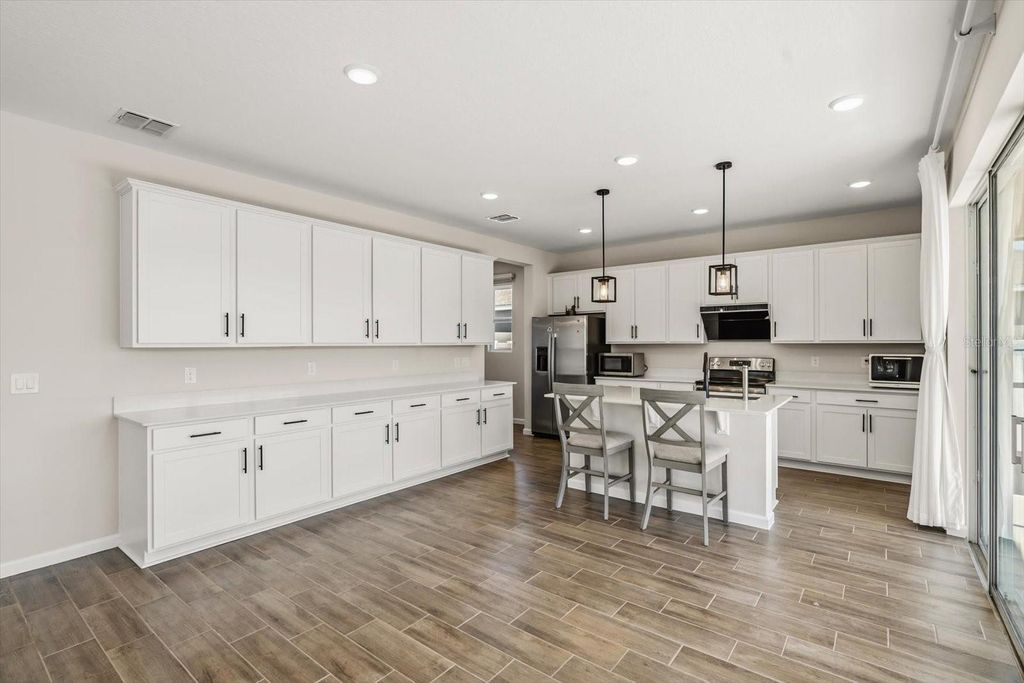 Photo of 3657 Sublett Loop, Tavares, FL 32778 (MLS # O6361605)