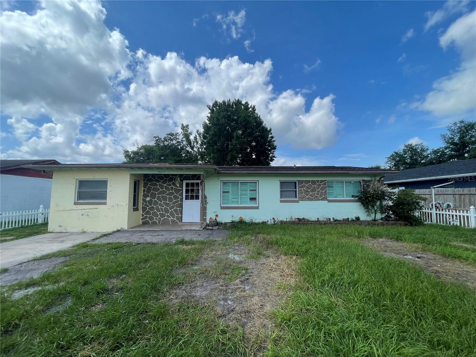 FIXER UPPER!!! Block home centrally located. In law suite with separate entrance. Home is being sold AS IS. No repairs will be made. newer AC