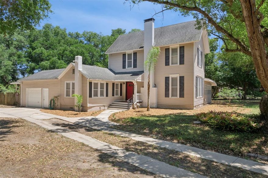 Step back in time and experience the timeless character of this truly remarkable historic home, originally built in the 1880s as a hunting lodge and situated on just over a half acre surrounded by mature trees and natural beauty. Rich with history, craftsmanship, and charm that simply cannot be replicated, this one-of-a-kind property offers 4 bedrooms, 2.5 bathrooms, and 2,625 square feet of living space designed for those who appreciate the soul of an older home. Set back from the main road with a long side driveway and an oversized attached two-car garage perfect for a workshop, hobbyist, or car enthusiast, the property immediately welcomes you with its inviting front porch and unforgettable curb appeal. Inside, the home showcases stunning original wood plank flooring throughout the living and dining rooms, along with the beautifully preserved original staircase that makes an unforgettable first impression as it wraps gracefully to the second floor. Historic details remain intact throughout the home, including handcrafted glass windows, tall baseboards, original framed doorways, glass door hardware, crown molding, and multiple fireplaces that add warmth and authenticity to nearly every space. The kitchen beautifully balances modern updates with vintage character, offering granite countertops, upgraded cabinetry, stainless steel appliances, brass-style fixtures, vaulted tongue-and-groove ceilings, and an incredible collection of original windows that flood the space with natural light. The downstairs primary suite offers convenience and privacy with an adjoining bath and direct access toward the garage area. A rare and unexpected feature of the home is the true cellar—something almost impossible to find in Florida homes of any era. Upstairs, three additional bedrooms continue the home’s historic charm, including a second potential primary suite complete with its original fireplace and an adjoining bonus room ideal for a nursery, dressing room, office, or reading retreat. The living room centers around a gorgeous framed fireplace with original brick accents, while the oversized dining room features its own fireplace and French doors leading to an expansive covered back porch overlooking the fenced backyard. Just off the dining room is a stunning oversized den or study featuring French doors, abundant natural light, and endless flexibility for a home office, library, sitting room, or additional entertaining space. Outdoors, you’ll find a charming fire pit area, chicken coop, and space for gardening—creating the perfect blend of historic elegance and country-inspired living. Major system updates provide peace of mind while preserving the home’s historic integrity, including a full repipe, 2025 AC system, Transferable Termite Bond, and a brand-new roof to be installed prior to closing. For the buyer who appreciates craftsmanship, history, and architectural beauty, this extraordinary home is more than a property—it’s a piece of history waiting to be cherished for generations to come. Make an appointment to see it today!