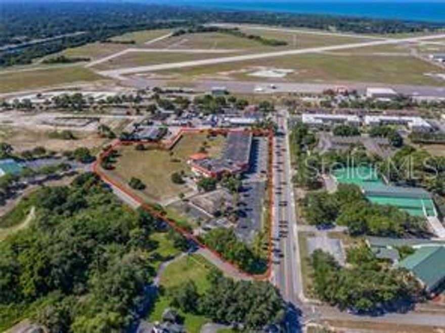 Land and buildings next to a private airport on the Island in Venice Florida. Property encompasses 1111 and 1225 Avenida Del Circo.
