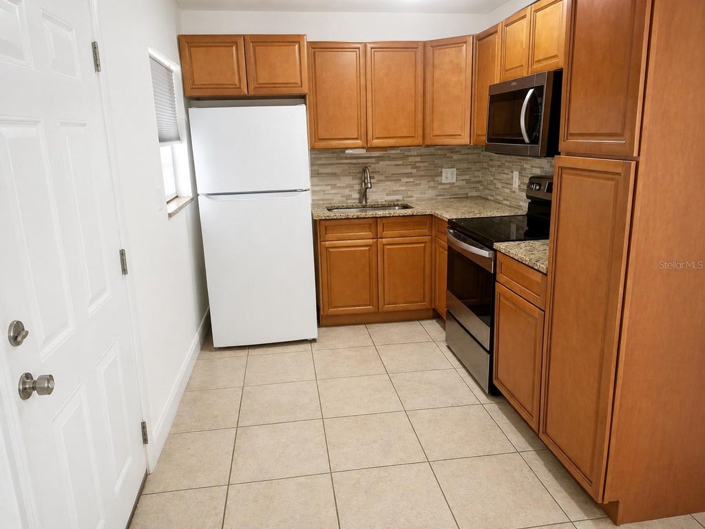 Photo of 1205 Avenue L, Haines City, FL 33844 (MLS # O6439498)