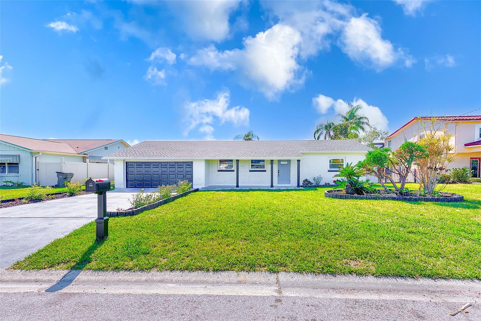 Welcome to your dream waterfront retreat in the coveted Bay Crest Park community of Tampa! This stunning 3-bedroom, 2-bathroom, 2-car garage home has been meticulously transformed into a modern coastal haven, offering direct bay access for all your boating adventures. From the moment you step inside, you’ll feel the thoughtful design and craftsmanship that set this property apart.
Inside, you’re greeted by luxury vinyl flooring throughout and an immediate water view from the entryway. The front living room boasts a designer accent wall with custom lighting, seamlessly connecting to the heart of the home — a completely renovated kitchen with stylish gray cabinetry, quartz countertops, backsplash, slate appliances, and a breakfast bar. Just off the kitchen, you’ll find a spacious utility room with storage and pantry potential, leading directly to the 2-car garage and bonus storage room.
The home offers plenty of space for entertaining with a central dining area and multiple entertaining zones. The primary ensuite bedroom overlooks the water, featuring a fully remodeled bathroom with a new vanity, lighted mirror, shiplap accent wall, and a floor-to-ceiling tiled shower with matte black finishes. The second bedroom is conveniently located near the fully updated guest bath, complete with a new vanity, lighted mirror, and a tub/shower combo. A third spacious bedroom sits just off the living area, offering flexibility as a guest room or home office.
Additional living space shines in the large Florida room with hurricane-rated sliders that fully retract to create a seamless connection between indoor and outdoor living — perfect for entertaining or simply soaking up breathtaking water views.
Step outside to discover your private backyard oasis featuring a paver patio, deck, luxury pergola, hot tub, fire pit, and ample room for gatherings. A brand-new seawall and dock ensure you’re ready for waterfront fun and boating adventures at a moment’s notice.
No detail has been overlooked in this top-to-bottom renovation. Upgrades include a new roof, HVAC, updated electrical and plumbing, impact windows and doors, hurricane-rated garage door, water heater, seawall, and dock. While this home did experience flooding during the most recent hurricane, all remedies were handled immediately and professionally, providing peace of mind for years to come.
Nestled in the sought-after Bay Crest Park community in Town ’N’ Country, this property offers unmatched convenience — minutes to Tampa International Airport, downtown, shopping, dining, and world-renowned Gulf beaches.