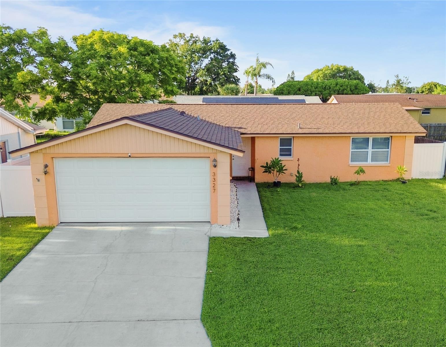 PRICED TO SELL! Charming 2 bed / 2 bath Holiday home with a remodeled kitchen (2024), new fence, and new washer, dryer & stove. Bright open layout, tile floors, and a spacious 2-car garage. Large master suite with ensuite bath. No HOA and did not flood during the 2024 hurricanes. Minutes from Anclote Beach, Tarpon Springs, shopping & dining. Move-in ready and investment-friendly—schedule your showing today!