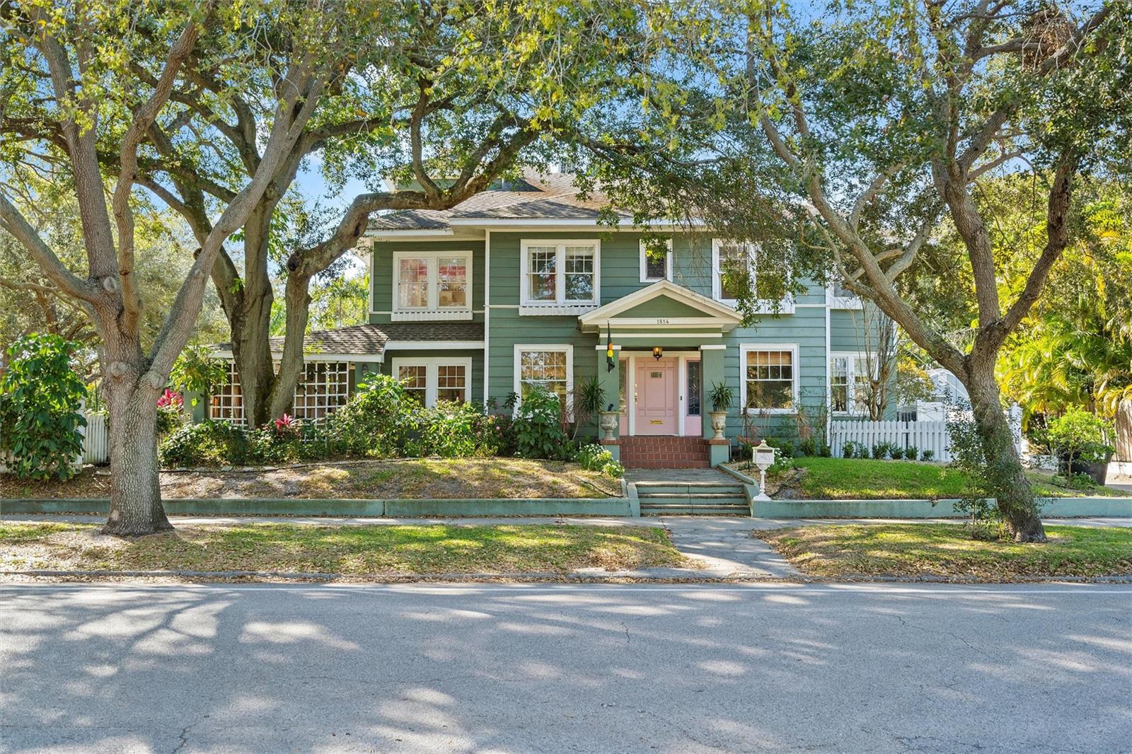 Incredible once in a lifetime opportunity to own this Iconic Colonial Style Estate in Historic Old NE. Perfectly situated on just under 3 lots with tremendous privacy and an impressive stately sized pool surrounded by your own secret gardens. NO FLOOD INSURANCE REQUIRED and mere minutes to vibrant Downtown St Petersburg. Incredible floor plan and layout with 5 bedrooms and 6.5 bathrooms, this estate home is the perfect combination of modern finishes and 1920s elegance with high ceilings, decorative trim, and crown moulding, along with striking hardwood Brazilian Cherry and bleached oak floors. This home is brimming with architectural features! Downstairs includes an elegant formal living room with ornate wood fireplace, formal dining room, Florida room, game room, large family room and a bright designer kitchen with custom cabinets, granite countertops, hidden walk-in pantry, stainless steel appliances, and gleaming island with bar seating. Large utility room. French doors open to a sprawling landscaped garden, wraparound porches, and large heated pool with waterfall, gazebo, outdoor pool half bath, and a large shed. Inside follow one of two staircases to the second floor which features an elegant master suite overlooking the pool with gas fireplace, large master bathroom, and large walk around closet, 4 additional generously sized bedrooms each with an en-suite bathroom. Additional features include an office loft, air-conditioned converted attic storage, attached 2 car garage, and workshop area. Many important updates have been taken care of including but not limited to extensive plumbing and electrical. Truly distinctive home in one of the most desirable St Pete locations with additional bonus of an easy walk or bike ride to Straub Waterfront Park, and downtown St. Petersburg with museums, fine dining, and shops. Walk or paddle along the waterfront, take your bike or golf cart to vibrant downtown shops, restaurants and museums or enjoy one of our major sporting and entertainment venues. Schedule a private showing you will not be disappointed.