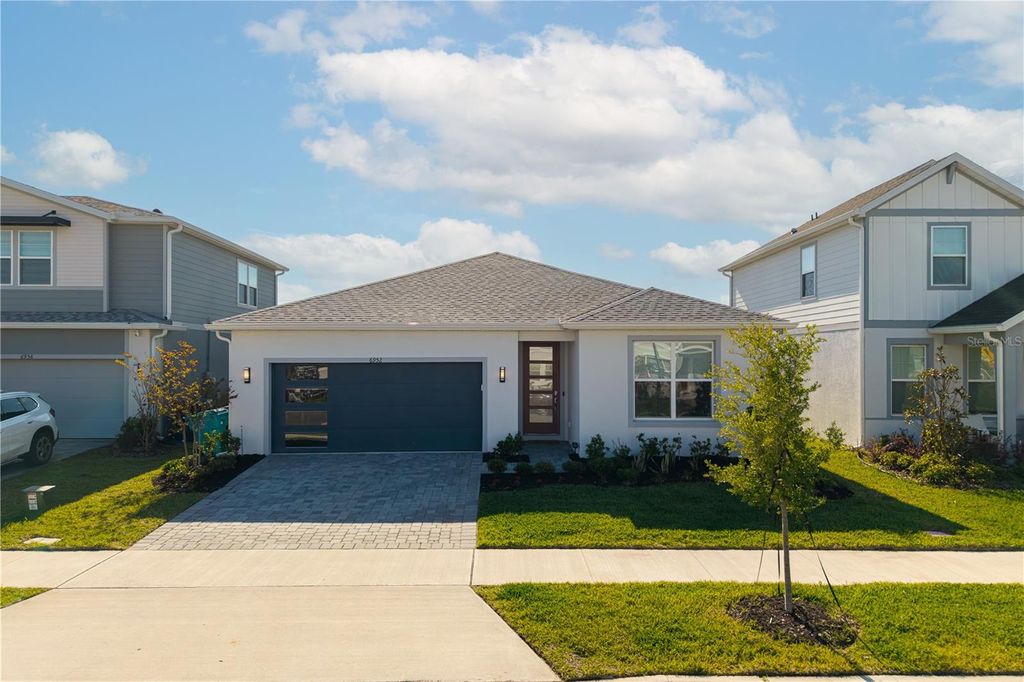 Photo of 6952 Rosy Sky Avenue, Orlando, FL 32829 (MLS # TB8501192)