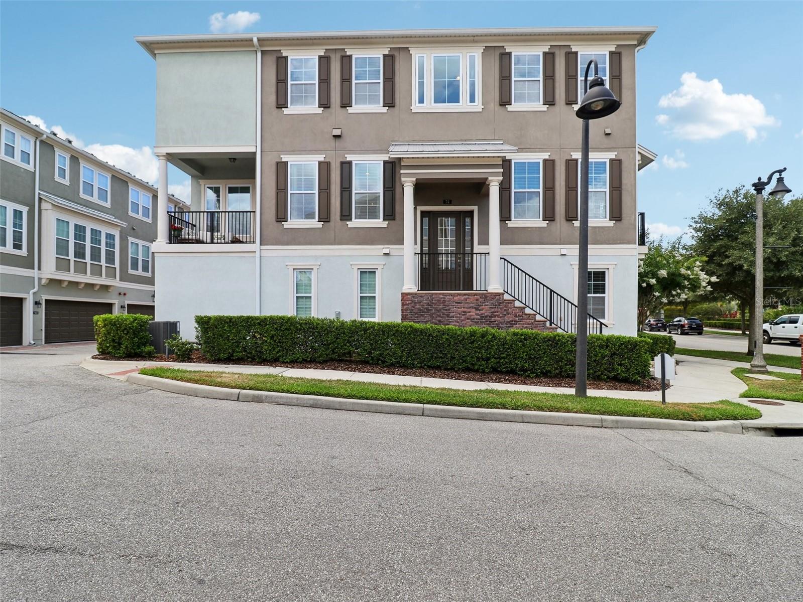 *** Multiple Offers; Send Highest and Best*** Come take a look at this luxury townhouse in the highly desirable Hamptons at Oviedo on the Park! This 3 bedroom, 3.5 bath is a must see! These Hamptons End units are hard to come by and don’t hit the market often! This one is sitting on a premium lot and has many upgrades throughout giving the property an executive feel. The home has an abundance of natural light and the kitchen is a cook's dream; stainless steel appliances, oversized working island with sit up bar, quartz counters, 42-inch cabinets with additional upper cabinet's/ Soft close cabinet doors! This floor plan has two balconies on the main floor with upgraded tile including a Juliet balcony off the family room provides an additional opportunity to step outside, breathe in fresh air, and view rockets being launched from the Space Coast. The first floor has a perfect flex bedroom that could be used as an office or a in law suite that has its own bathroom. The master bedroom includes an extra large walk-in custom closet with pocket doors. The Master bath includes Upgraded glass walk-in shower with a rain shower head and Upgraded cabinets and Tiles. The security system upgrade is hardwired into the house as well the internet booster. All of this in a fantastic location that has some of the best walkability with Oviedo on the Park and many restaurants and stores nearby. The park has many functions and concerts year around giving these residence an amazing lifestyle. Book your appointment now before this gem is gone!