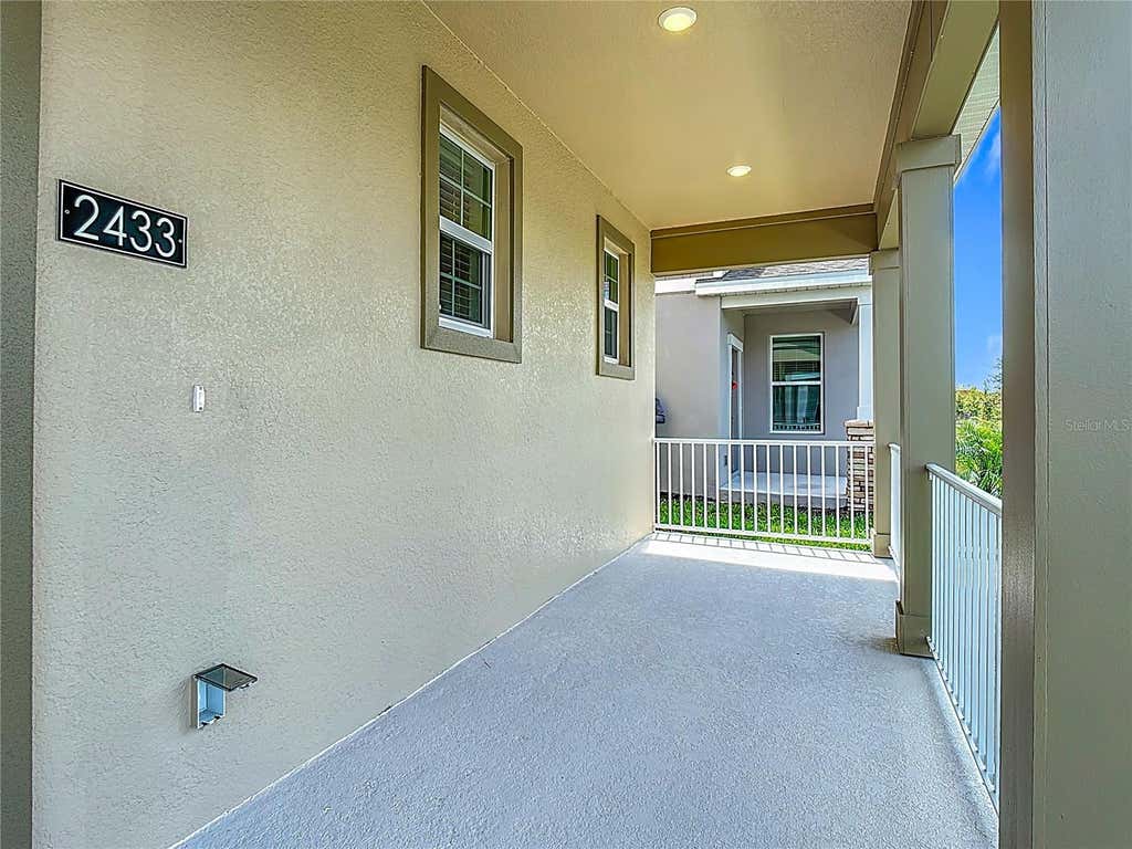 Photo of 2433 Spring Tune Alley, Kissimmee, FL 34744 (MLS # O6429024)