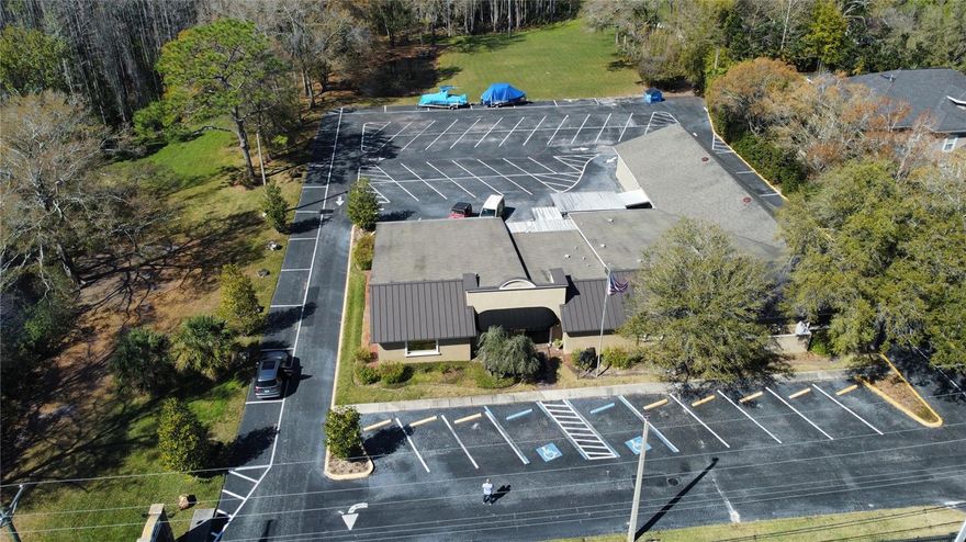 Price Reduction!!!!  OFFICE SPACE OPPORTUNITY. Incredible Multi-Office Building available, bring your company or use as a multi tenant building. Currently being used as Office/Workspace, but could be used for multiple uses including a private school. The professional building has a lovely reception and waiting area. The offices vary in size and are beautifully furnished with modern office furniture. Each office has its own Key Pad making it extremely secure. The building sits on a prime piece of land that has 66 parking spaces and a beautiful landscaped area with a huge lawn. It is located in a perfect area of Tampa with excellent access to the Veterans and many amenities.