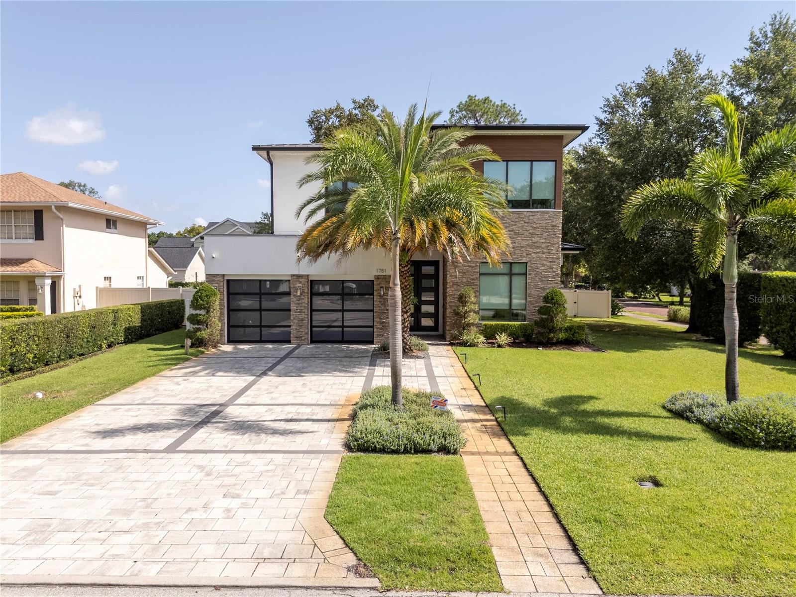 An exceptional custom home by award-winning Davila Homes, perfectly blending modern design and functionality. Located in sought-after Conwill Estates, just minutes from Park Avenue, this 5-bed, 4.5-bath residence features volume ceilings, floor-to-ceiling bronze sliding doors, and a seamless indoor-outdoor living experience.
The chef’s kitchen showcases waterfall quartz countertops, Sub-Zero & Wolf appliances, a large island, walk-in pantry, and opens to the living area with phantom screens and views of the resort-style gas-heated pool, fire pit, and a brand-new outdoor kitchen, perfect for entertaining.
A first-floor owner’s suite offers pool views, private terrace, motorized shades, spa bath with soaking tub, and expansive shower. Upstairs you'll find 4 en-suite bedrooms, a bonus room with wet bar, wine fridge, 2nd laundry, and balcony overlooking the backyard.
Additional upgrades include Summer Kitchen, surround sound, gas fireplace, upstairs & downstairs laundry, private well for irrigation, generator, new HVAC system for downstairs (2025), new water heater (2025), and air-conditioned garage with tiled floors (not included in living SF).
This home has been impeccably maintained and is in pristine condition — it truly feels like new. From the moment you step inside, you’ll fall in love with its elegance and charm.