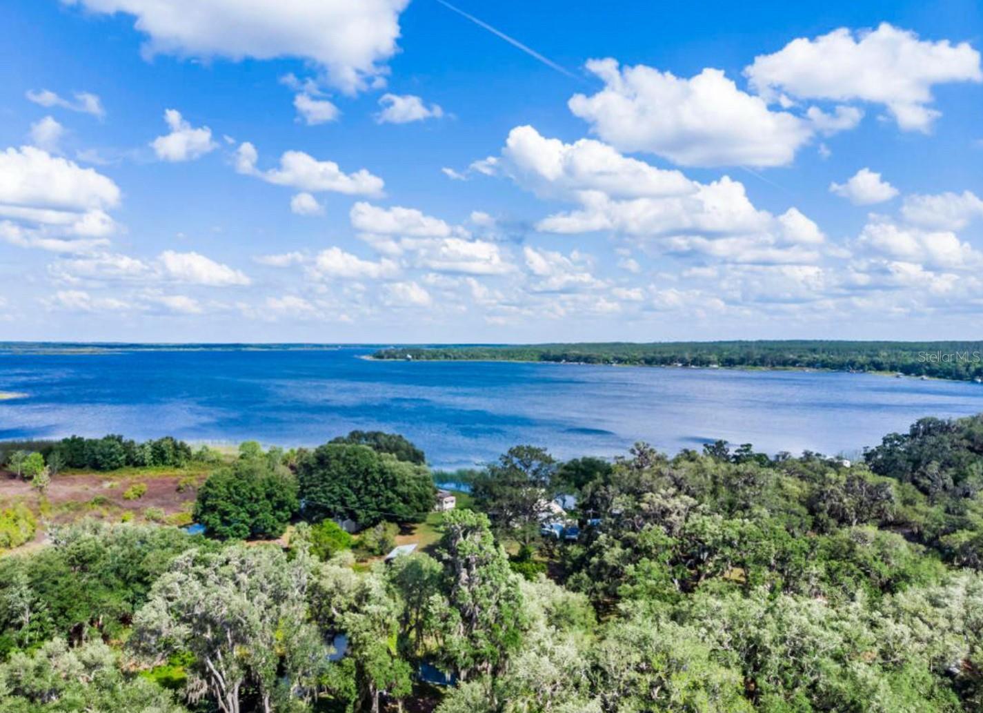 Waterfront Retreat on Lake Kerr – Fully Updated 3-Bed, 2-Bath Home
Experience lakefront living at its finest in this beautifully renovated 3-bedroom, 2-bath double-wide home, ideally situated on a spring-fed freshwater canal with direct access to the crystal-clear waters of Big Lake Kerr.
Nestled beneath the shade of picturesque mature oaks on just under a quarter acre, this spacious 1,296 sq ft residence seamlessly blends classic charm with modern upgrades. Inside, enjoy a bright and open layout featuring a fully remodeled primary bathroom, an enclosed laundry room, and brand-new stainless steel appliances—including a dishwasher, over-the-range microwave, and refrigerator.
Step outside to enjoy the best of Florida living with a new back porch perfect for relaxing or entertaining, and a 10x22 private dock—ideal for boating, fishing, or simply soaking in the tranquil surroundings.
Originally built in 1974, this thoughtfully updated home offers both comfort and style, making it a perfect full-time residence or serene weekend escape.
Don’t miss your chance to own this elegant lakefront gem on sought-after Lake Kerr.