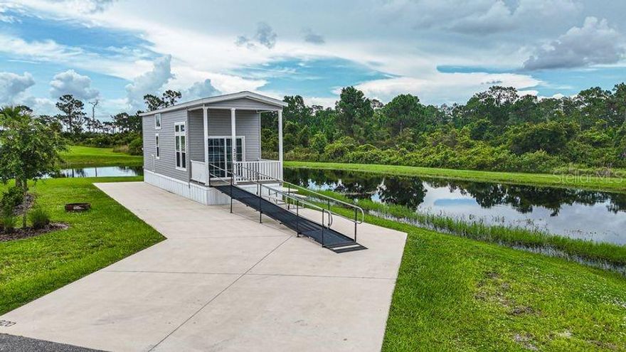 Experience refined resort living in this beautifully designed loft-style tiny home located within the stunning 435-acre Resort at Canopy Oaks luxury resort. Thoughtfully crafted for comfort and flexibility, this charming retreat sleeps up to six guests and features a private bedroom, a spacious king bed in the loft, and a convenient pullout sofa — perfect for hosting family and friends.

Enjoy peaceful pond views from Lot 320, complete with an accessibility ramp and the opportunity to add your own private sun deck for enhanced outdoor living. The covered front porch offers the perfect space to relax, unwind, and soak in the tranquil surroundings.

Residents enjoy access to an impressive array of resort-style amenities, including a sparkling pool and relaxing spa, a vibrant tiki bar featuring live music, a beautifully maintained putting green, and pickleball courts — all set within peaceful, professionally landscaped grounds that enhance the community’s natural beauty.

Whether you’re seeking a personal getaway, a seasonal retreat, or a smart investment, this property offers flexibility with the option to participate in the resort-managed rental program.

Ideally located in Central Florida, you’re just a short drive from world-class fishing, major attractions, shopping, and dining.