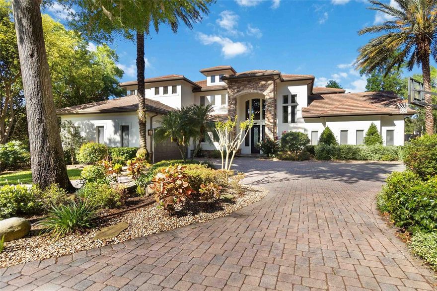 ** Sellers offering a RATE BUY DOWN** Welcome to the epitome of lakefront living in the prestigious Windermere Downs Community located along the banks of the third largest lake on the famed Butler Chain of Lakes, Lake Down. Nestled on a serene cul-de-sac, 9720 Nearwater Place presents an unparalleled opportunity to indulge in refined elegance, transitional style and tranquil waterfront living. This magnificent estate boasts timeless architectural design, seamlessly blending classical grandeur with modern amenities. Spanning across just over 6000 square feet of opulent living space, every detail of this residence exudes sophistication and exclusivity.

Upon arrival, you're greeted by lush landscaping and a grand entrance, setting the tone for what lies beyond. Step inside to discover a grand foyer adorned with exquisite tile flooring and soaring ceilings, leading you into the heart of the home.
The expansive living areas are bathed in natural light, courtesy of oversized windows that offer breathtaking views of the meticulously manicured grounds and the pristine lakefront. From the grand entrance to the inviting family room with a fireplace to the eat in breakfast nook, every space has been thoughtfully designed for both lavish entertaining and comfortable everyday living. Culinary enthusiasts will delight in the gourmet chef's kitchen, complete with top-of-the-line appliances, custom cabinetry, and a spacious island for culinary creations. Adjacent, a charming breakfast nook that overlooks the beautiful Lake Down is perfect for enjoying morning coffee or casual meals.

Featuring dual primary suites, 2 additional bedrooms, a dedicated office, 9 seat theatre, a loft space with wet bar and a bonus flex room, you will find that this thoughtfully designed floor-plan can accommodate the needs of the masses. After a long day you can retreat to the luxurious master suite where tranquility meets indulgence. This private sanctuary features a sitting area, a custom walk-in closet, and a spa-like ensuite bath, offering a serene escape from the hustle and bustle of everyday life. Entertainment abounds throughout the property, with a state-of-the-art home theater, a wine cellar, a dedicated loft space which serves as a fantastic game room providing endless opportunities for leisure and relaxation. Step outside to discover your own private paradise, complete with picturesque views, a sparkling pool, spa and an expansive patio ideal for alfresco dining and entertaining guests. Enjoy the warm Florida sun while lounging in the backyard oasis or take a stroll through the lush greens enveloping the property.

This estate is conveniently located along the chain of lakes in one of Windermere's most coveted neighborhoods, Windermere Downs. Residents enjoy convenient access to top-rated schools, world-class golf courses, world renowned lakes, upscale shopping, and fine dining options just moments away. Escape to luxury and make 9720 Nearwater Place your own slice of paradise in the Sunshine State. Schedule your private showing today and experience the epitome of refined living in Windermere, Florida.