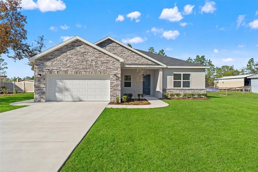 One or more photo(s) has been virtually staged. Welcome to 15171 Pomp Parkway, Weeki Wachee, FL 34614 — a brand-new Royale model by Southern Crown Homes, built with ICF (Insulated Concrete Form) construction for exceptional strength, energy efficiency, and quiet comfort.

This new construction home is filled with natural light, enhanced by an open-concept layout and high ceilings that create a bright, welcoming atmosphere. Luxury vinyl plank (LVP) flooring runs throughout the entire home, providing a seamless, modern finish that’s both durable and low-maintenance—ideal for everyday living, pets, and entertaining.

The kitchen is thoughtfully designed with 42” upper cabinets, solid-surface countertops, stainless steel appliances, and generous prep and storage space, opening directly to the great room for easy flow and connection. Whether hosting guests or enjoying a quiet evening, this space is designed to bring family and friends together.

The primary bedroom is spacious and serene, offering a true retreat. The ensuite bath is well-appointed, and the massive walk-in closet is a standout feature—designed to accommodate extensive wardrobes and organization needs, perfect for any fashionista who values space and function.

Secondary bedrooms are well-sized and versatile, suitable for family members, guests, or a home office. Every space reflects thoughtful planning and quality finishes.

Step outside to the covered rear lanai, overlooking a large ½-acre lot located on a paved road, adding both convenience and curb appeal. With this amount of land, there’s ample room for a pool, outdoor kitchen, garden, play area, or future expansion.

Additional features include:

ICF exterior construction for superior insulation and durability

Energy-efficient Low-E windows

Energy-conscious HVAC system

Stone-accented exterior

Attached garage with opener

2-10 home warranty for peace of mind

Located near Weeki Wachee Springs, parks, outdoor recreation, dining, and shopping, this brand-new Royale home offers quality craftsmanship, modern finishes, and space to truly enjoy—inside and out.
