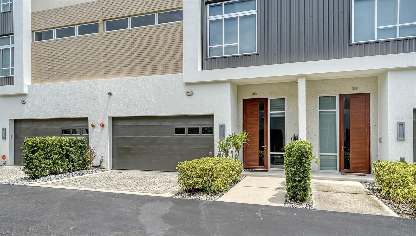 WELCOME Home to The Q an Enclave of 40 Townhomes with varied floorplans, located on Ringling Boulevard in The Heart of Downtown Sarasota! 213 Cosmopolitan Court offers the largest floorplan with three floors of spacious living, one bedroom and en-suite bath along with lovely daytime living space off both the first and second floor bedrooms. Each floor of the three floors has one bedroom and en-suite area. The open space can be used in a variety of ways. Choose to make an office area, a study, a music area, it's your decisions create the best functionality for your lifestyle. No neighbors above or below!
913 Cosmopolitan Court is the perfect floorplan for entertaining guest--- designed with a half bath located near the living room. This lovely townhome has a private elevator, two-car garage with a custom finished third floor patio complete with a retractable roof top and sunshades. The Q enclave includes commercial grade Miami-Dade impact-rated windows and doors, luxurious Lube Italian kitchen and bath cabinetry, Bosch appliances with natural gas cooktop, Caesarstone quartz countertops and German Hansgrohe plumbing fixtures. The all-interior doors are solid core, 8-foot-tall dark wood, volume ceilings, a stylish freestanding soaking tub, spacious showers and large closets. Built in ceiling 'invisible' ceiling speakers along with state of the art in home customizable programmable security system. Premium porcelain tile flooring, first and second floor terraces, a tankless hot water system and upgraded water system was installed by owners after the build was completed. 213's bathroom and kitchen areas have been finished in beautifully mosaic tile work throughout. Oversized windows throughout with custom Hunter-Douglas window treatments makes the internal lighting comfortable at all times. The Q community is deeded fee simple, so owners own the land your residence is built on. NO CDD, and the monthly fees are some of the lowest in downtown Sarasota. The location is a quick distance to fine restaurants, specialty stores, banks and opera house, a marina and theatrical arts and two movie theatres. Whole Foods Market, Sprouts grocery, and a weekly year ground Saturday farmer’s market on main street are all in downtown Sarasota. This location is currently Zoned X- which requires no Flood Insurance.