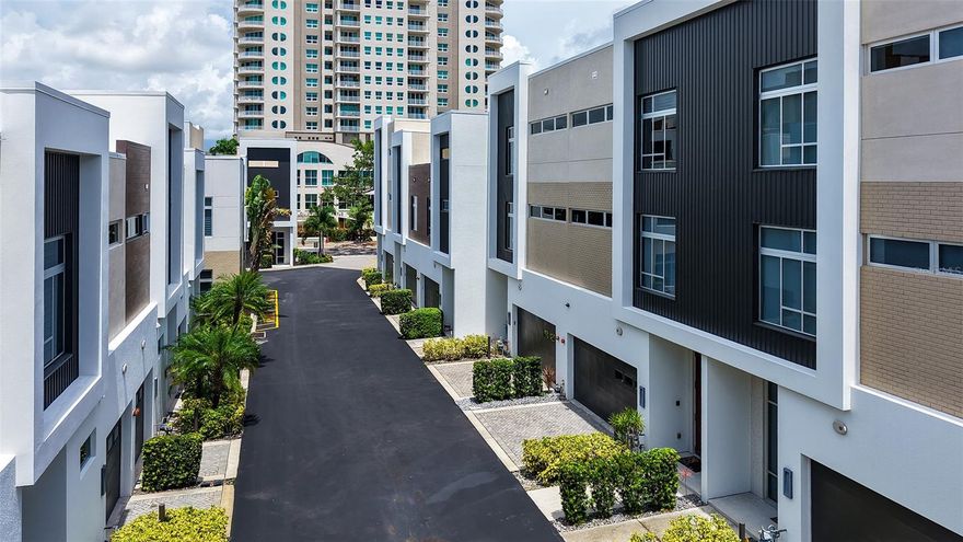 WELCOME Home to The Q an Enclave of 40 Townhomes with varied floorplans, located on Ringling Boulevard in The Heart of Downtown Sarasota without the high fees typically associated with downtown residences!  213 Cosmopolitan Court offers the largest floorplan with three floors of spacious living, one bedroom and en-suite bath along with lovely daytime living space with custom built-in bookshelves off both the first and third floor bedrooms. Each floor of the three floors has one bedroom and en-suite area. All bedrooms have custom built in closet systems. The open space can be used in a variety of ways. Choose to make an office area, a study, a music area, it's your decisions create the best functionality for your lifestyle. Floors one and two have walk out terraces.  No neighbors above or below!
913 Cosmopolitan Court is the perfect floorplan for entertaining guest--- designed with a half bath located near the living room. This lovely townhome has a private elevator, two-car garage with a custom finished third floor patio complete with a covered roof top and electric sunshade. The Q enclave includes commercial grade Miami-Dade impact-rated windows and doors, luxurious Lube Italian kitchen and bath cabinetry, Fulgor Milano appliances with natural gas cooktop and Bosch dishwasher, Caesarstone quartz countertops and German Hansgrohe plumbing fixtures. The all-interior doors are solid core, 8-foot-tall dark wood, volume ceilings, a stylish freestanding soaking tub, spacious showers and large closets. Built in ceiling 'invisible' ceiling speakers along with state of the art in home customizable programmable security system. Premium porcelain tile flooring, first and second floor terraces, a tankless hot water system and upgraded water system was installed by owners after the build was completed. 213's bathroom and kitchen areas have been finished in beautifully mosaic tile work throughout. Oversized windows throughout with custom Hunter-Douglas window treatments makes the internal lighting comfortable at all times. The Q community is deeded fee simple, so owners own the land your residence is built on. NO CDD, and the monthly fees are some of the lowest in downtown Sarasota. The location is a quick distance to fine restaurants, specialty stores, banks and opera house, a marina and theatrical arts and two movie theatres.  Whole Foods Market, Sprouts grocery, and a weekly year ground Saturday farmer’s market on main street are all in downtown Sarasota. This location is currently Zoned X- which requires no Flood Insurance.