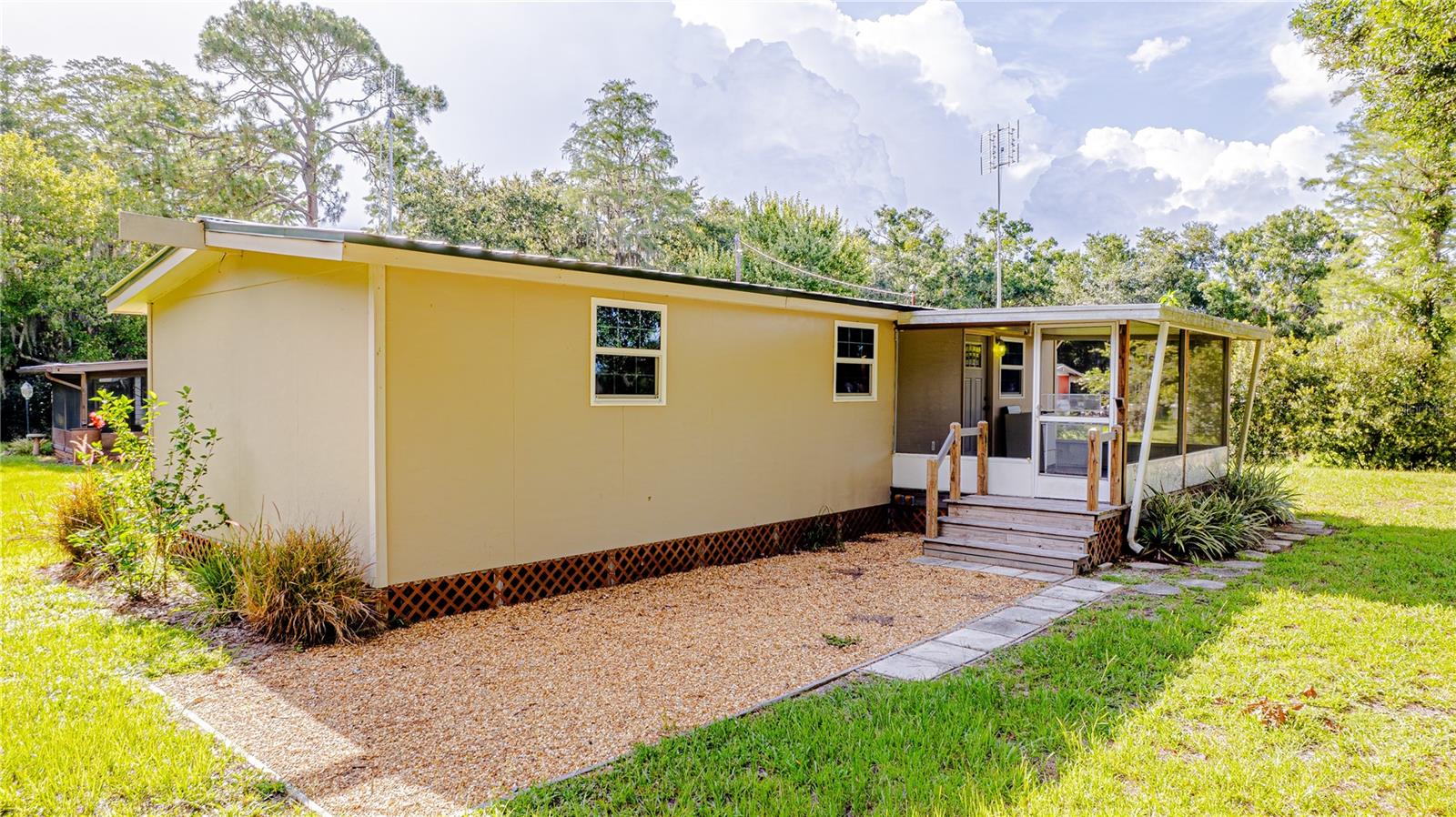 COMPLETELY REMODELED CABIN......metal roof & gutters, vaulted ceilings with beams, NEW WINDOWS & CASINGS, heart-of-pine counters and a FARMHOUSE sink in the kitchen......where are my fishermen or savvy hunters?!?! !!!MAKE SURE TO READ TO THE VERY END......IMPORTANT SIDENOTE!!! CUSTOM BATH VANITIES FROM VINTAGE FURNITURE PIECES, new lights, new faucets, new medicine cabinets, REPURPOSED FENCE SLATS FOR CHIC SHIPLAP WALLS, & vinyl flooring throughout. HUGE WALK-IN CLOSET & a convenient PRIVATE half bath for the bedroom. Mini Split a/c units are fairly new.....all window a/c units help to keep things extra cool and they will stay. OVERSIZED SCREENED-IN PORCH at the back of the home....enjoy the water view without pesky bugs. Beautiful Bamboo, Palm, Oak, & Cypress trees create the best haven for many birds.....including an Eagle's nest within view!! The front is fenced with a gated-entry......we have a pebble-rock area for chairs, a picnic table or parking THE ATV. Utilize the front concrete pad for a future covered patio & extra entertainment spot. WE HAVE AN RV HOOK-UP ALSO!! Plant a garden, sit around the firepit in the evenings, complete the fence to let the pups run, bring the poles and have fun catching fish in the Cypress bend. THE HOME NEXT DOOR IS ALSO AVAILABLE FOR SALE---425 1ST STREET.....have family you need close by?? Maybe some in-laws who need their own space?? Make us an offer & truly savor both cabins in this QUIET COUNTRY SETTING. Lake Marian boat ramp is less than a mile away. RV HOOK-UP IS IN PLACE!!! The water softener is brand new!!!