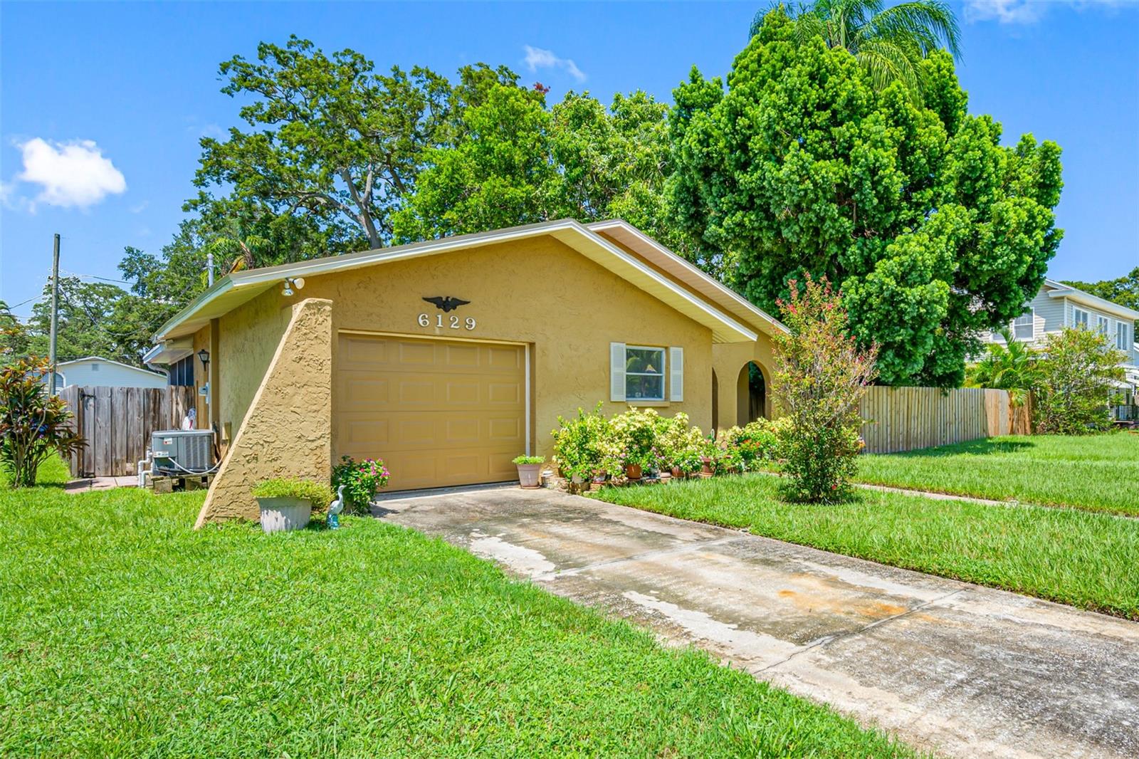 This charming home, featuring 2 spacious bedrooms and 2 bathrooms, is situated in the heart of East Pasadena. With solid block construction, this home is centrally located near award-winning beaches and just minutes from the vibrant downtown of St. Petersburg. The expansive fenced backyard offers endless possibilities for outdoor enjoyment, whether you're looking to garden, entertain, or simply relax. Enjoy your mornings and sunsets in the cozy screened Florida Room or on the inviting outdoor patio.
Beyond your property, you'll find the Pinellas Trail—a unique greenway corridor that connects some of Pinellas County's most scenic parks, coastal areas, and residential neighborhoods, perfect for biking or walking. The home also includes a 1-car garage with convenient indoor laundry, accessible from the driveway at the front.
You'll love the proximity to shopping, dining, airports, beautiful beaches, and the charming town of Gulfport. This has been a beloved family home for decades, and now it's ready for you to make it your own. Don't miss the chance to transform this sweet home into your dream space—schedule your appointment today!