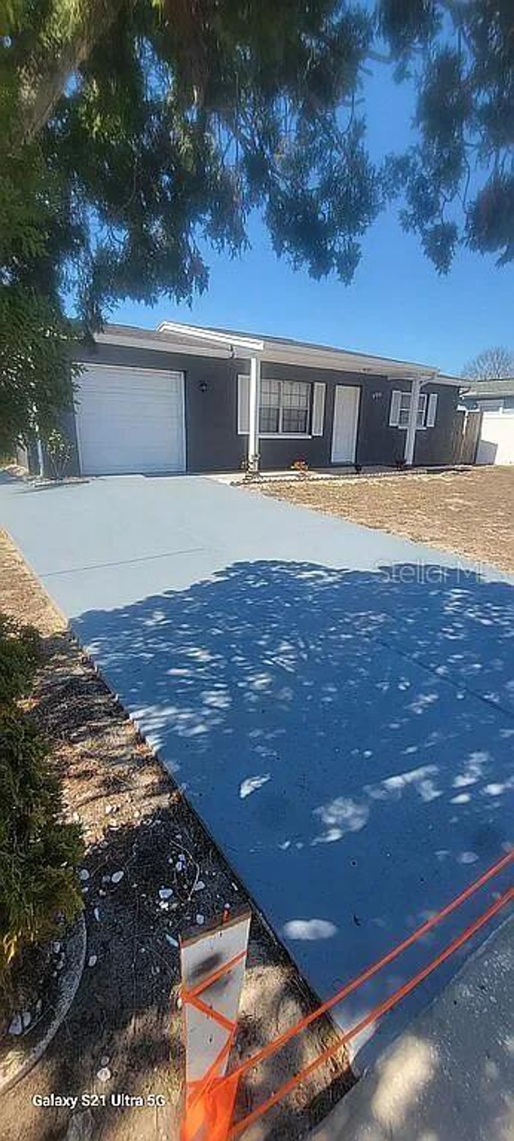 Photo of 9901 Woodstock Lane, Port Richey, FL 34668 (MLS # O6392565)