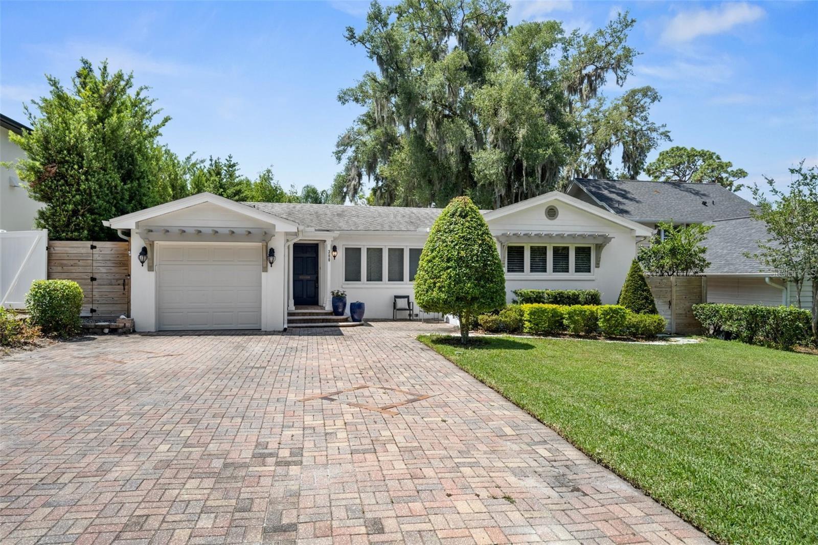 Lovely two bedroom, one bath bungalow in great Winter Park neighborhood. This home features over 1,100 square feet of living space with a great open plan. Light and bright with lots of windows and wood floors. Gorgeous, updated kitchen with newer appliances, quartz counters and huge island. Spacious bath with dual sinks. Large bonus room with Mexican tile and French doors that lead to the deck and fenced backyard. Paver driveway, one car garage with washer & dryer. Lawncare included