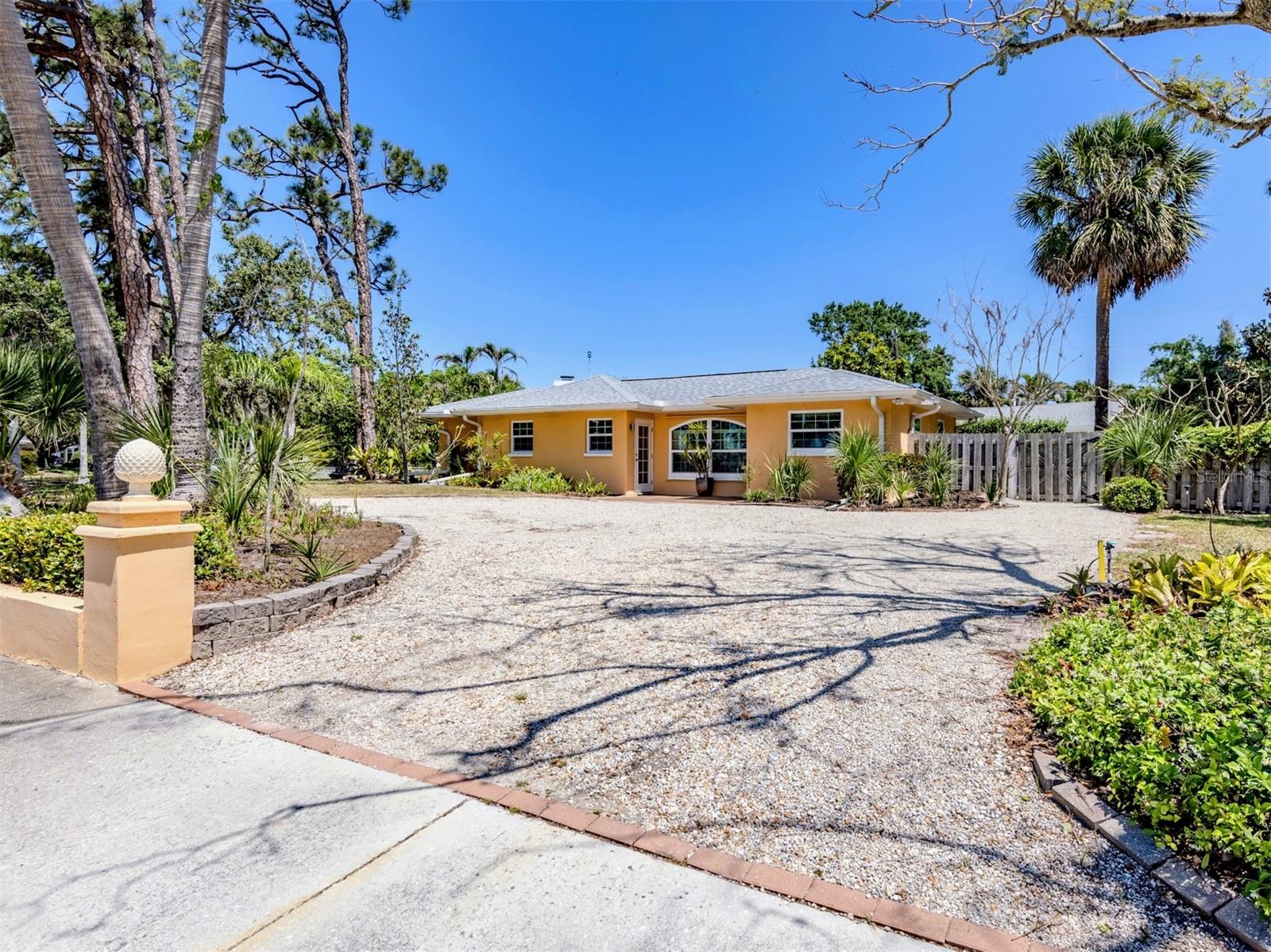 One or more photo(s) has been virtually staged. This incredible and truly unique home is perhaps the most ideal location on the Island of Venice. This exceptional 2220 sq. ft. home features: 3 bedrooms, 3 baths, plus office, plus art studio, plus workshop and huge parklike backyard and extra large, deep pool. Originally built in 1952 but has been extensively remodeled over nearly 4 decades and major additions added including a large guest bedroom with a nursery with its own private entrance as well as a pool cabana with a large art studio and a large workshop.
Located in the original Venezia Park neighborhood, you are surrounded by many almost 100 year old homes with their Northern Italian architectural design. What you will probably love most is this location; Only 1/2 block to West Blaylock Park and Arboretum and only 1/2 block to Venezia Park and playground both with picnic areas and walking trail.
Just about 3 blocks away is the Venice Cultural Campus with a new Venice Library, the Venice Art Center, The Venice Community Center and the Historic 100 year old Triangle Inn now the Venice History Center. Its an easy stroll of about 4 blocks to historic downtown Venice with its shops, excellent restaurants, galleries and Venice Theatre. Venice Beach is just about 4-5 blocks away. If you want to take a bike ride you are only about 6 blocks to the beautiful Venetian Waterway Trail that connects to the popular Legacy Trail in downtown Venice at the historic train station.
The kitchen is all newer as are most of the household appliances. All closets are cedar-lined wood. There is crown molding in almost every room. There are original wood ceilings in some of the mail living areas and all copper water lines have been re-piped with PEX pipe. The roof is 8 years old. The air conditioner is less than 1 year old. The pool pump and filter is about 1 year old. And most importantly the many windows and doors are all hurricane impact rated. The attic is extremely large with abundant storage space too.
This property is nearly one half acre plus a large front lot line easement and sits on TWO Island lots with a large circular drive. The back yard is extremely large and private with ample room for possible detached garage with guest quarters and/or an accessory dwelling unit which are permitted in the City of Venice. You could make this a large family compound with this extra large and premium 2 lot Island location.
Come and take a look today. You will be enchanted by all of the light that fills every room and the many windows and French doors letting in the beautiful sunlight, the Florida native greenery, trees, amazing, colorful flowers, plants and spectacular sunsets into the home. There is just a very special feeling in this impressive home and beautiful location. So come and see for yourself. You will certainly be glad you did. Thank You.