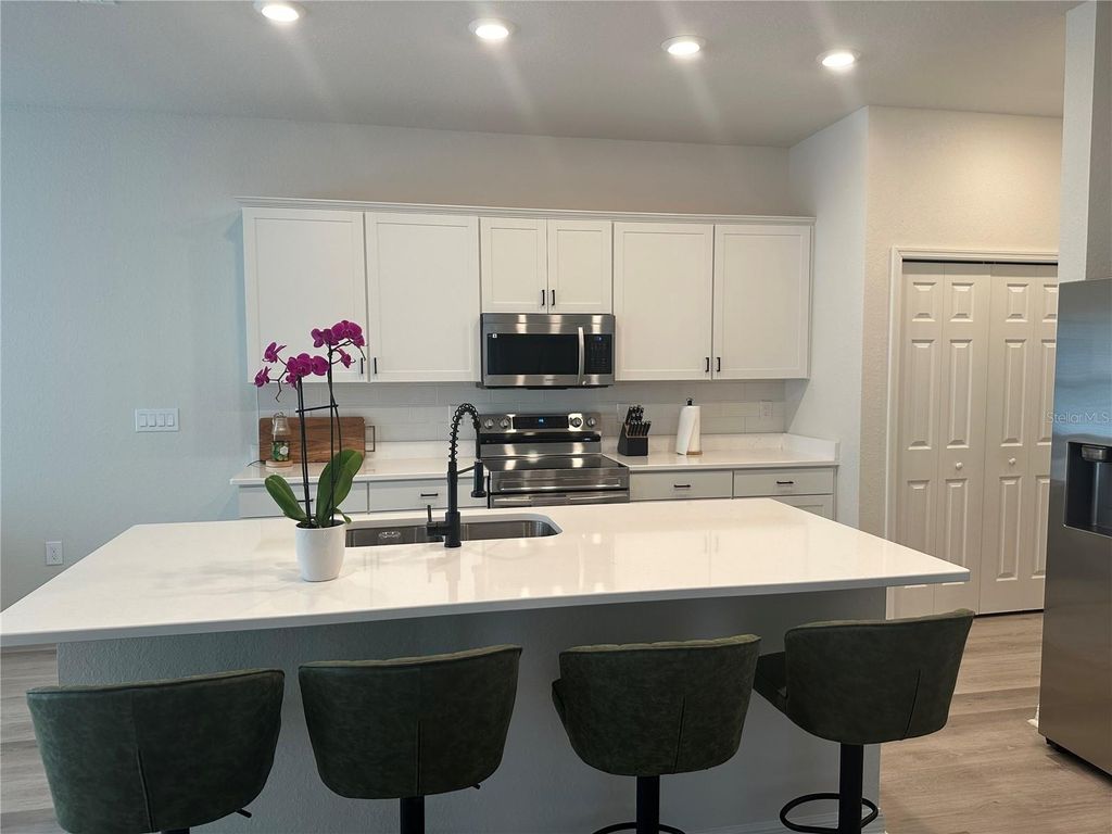 Photo of 452 Huckleberry Blossom Drive, Saint Cloud, FL 34771 (MLS # O6352621)