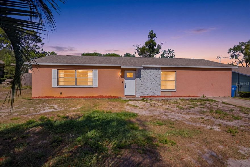 Set on 0.23 acres, this 3 bedroom, 2 bath home features an above ground pool, 6 year old roof, stone accented wall on the exterior and on the inside, light-toned tile flooring in the living room complemented by front-facing windows and a door leading to the expansive 14 x 5 storage closet. The dining area features laminate flooring, a convenient storage closet, and double sliding doors that lead to an additional enclosed space. Originally a covered patio, this area has been thoughtfully finished with walls, a wood paneled ceiling and carpeting, creating a versatile flex space that is currently being used as a bedroom. The kitchen sits just to the right and features tile flooring, solid surface countertops arranged in an L-shaped layout with extended prep space, a dual sink set beneath a window overlooking the covered patio space, black-toned appliances, and generous upper and lower cabinet storage. The primary bedroom provides a comfortable retreat with laminate flooring, built-in closet, multiple windows, and a spacious en-suite bath offering extended counter space, a single vanity with a large wall-mounted mirror, a window for natural light, and a tub-and-shower combination finished with tiled walls. A second bedroom shares the same laminate flooring and includes a built-in closet, French door access to the rear covered patio and a secondary door leading to the laundry room. The laundry room has built in overhead cabinets, a lot of additional space for storage, and a door leading directly to the side yard. The third bedroom also features matching flooring, a built-in closet, and it’s own updated en-suite bath with a single vanity and a tub-and-shower combination accented by tiled walls. Outside, the covered patio spans the rear of the home with a paneled ceiling and screened panels that frame views of the fenced yard, where an above-ground pool, storage shed, and open lawn space create a relaxed outdoor setting. The location offers convenient access to local highlights including Weeki Wachee Springs State Park for kayaking and clear spring waters, SunWest Park with its freshwater beach and water activities, and Anderson Snow Sports Complex, featuring trails, sports fields, and recreational amenities that add to the appeal of living in Spring Hill.