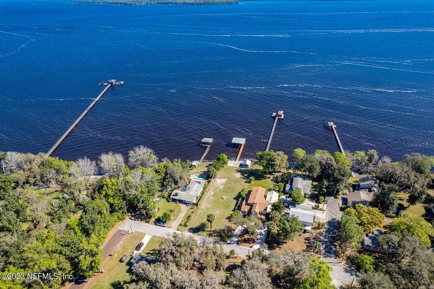 Don't miss this incredible opportunity to build your dream home on one of the only vacant lots along the St. Johns River in the heart of Green Cove Springs. This lot features 72 feet of frontage along the river, a 100+ ft. dock with brand new decking, a covered boat house with boat slip, and a concrete landing/sun deck with storage building. Hop on your bike or take a short walk and enjoy one of the many restaurants and shops nearby. It's less than a mile to Spring Park where you can cool off in the pool or let the little ones enjoy the splash pad. The park hosts several events throughout the year and a monthly food truck meetup from March to November. Completion of the First Coast Expressway will bring growth and accessibility to this area with many projects already planned or underway.