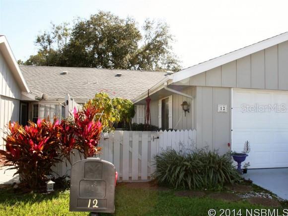 Spacious home in a beautiful golf community. Large eat-in kitchen overlooks courtyard. Florida room shaded by mature oak trees. Large 2 car garage. Located between 2 golf courses, 2 community pools by optional membership. ;Water: City