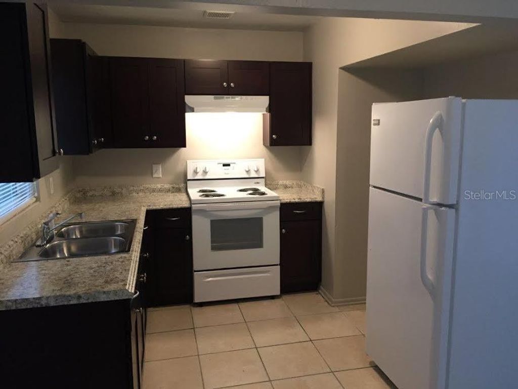 Photo of 5216 Palisades Drive, Orlando, FL 32808 (MLS # O6398049)