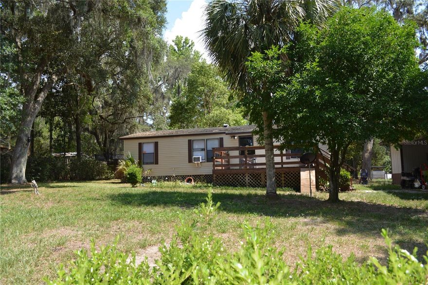 Sellers are anxious to sell! This spacious, well-kept home is ready for you. You have exclusive access to the Ocklawaha River where you can launch your airboat, small boat, enjoy fishing and swimming. This three bedroom, two bath, split floor plan makes for a great permanent home or plenty of room for the entire family as a weekend get a way as you enjoy the many amenities of the Ocala National Forest, where you can ride your ATV, horseback ride, enjoy the hiking trails and visit the many springs. The open floor plan allows for entertaining the entire party at one time, leaving no one out of the excitement, with the overflow enjoying the large deck on the front of the house. The lot offers plenty of room for your toys without feeling crowded, the second entrance located on the back lot makes it easy to pull you equipment through and park out of the way. Call for your showing today.