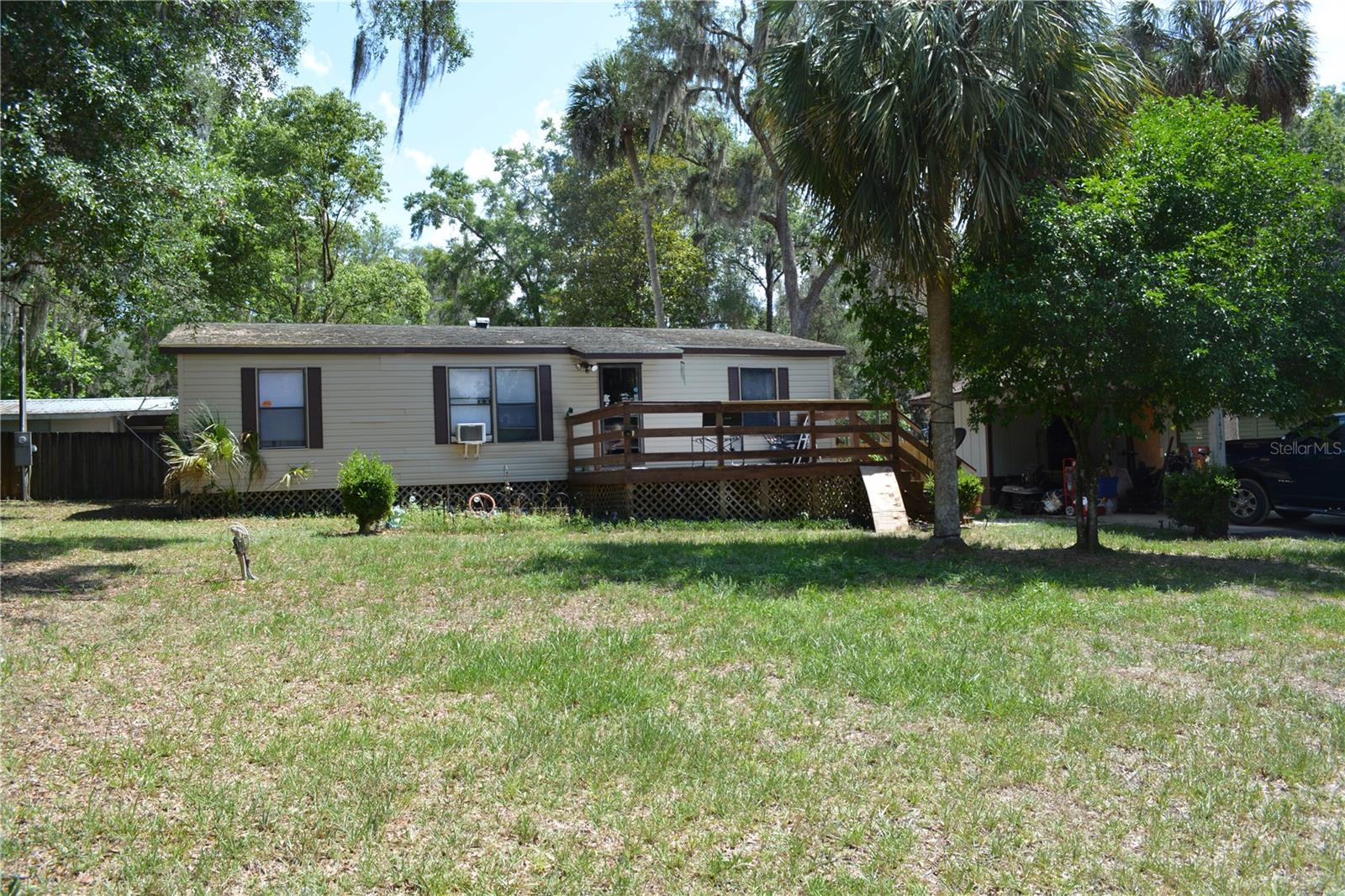 This spacious, well-kept home is ready for you. Located close (1,000 feet) to the Ocklawaha River, you have exclusive access to launch your airboat, small boat, enjoy fishing and swimming. This three bedrooms, two baths, split floor plan makes for a great permanent home or plenty of room for the entire family as a weekend get a way as you enjoy the many amenities of the Ocala National Forest, where you can ride your ATV, horseback ride, enjoy the hiking trails and visit the many springs. The open floor plan allows for entertaining the entire party at one time,
leaving no one out of the excitement, with the overflow enjoying the large deck on the front of the house. The lot offers plenty of room for your toys without feeling crowded, the second entrance at the back of lot makes it easy to pull you equipment through and park out of the way. Call for your showing today.