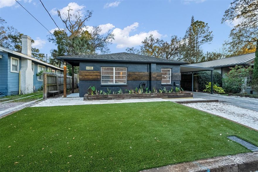 This beautifully renovated mid-century modern house PLUS GUEST HOUSE property in the heart of Seminole Heights offers a rare combination of architectural character, thoughtful updates, and a versatile layout that’s hard to find. The main residence features 3 bedrooms and 2 bathrooms across more than 1,100 square feet of well-designed living space, where original terrazzo floors nod to the home’s mid-century roots and pair perfectly with clean lines, modern finishes, and an airy, light-filled interior. The open living and dining areas flow effortlessly, creating a comfortable and functional layout for everyday living or entertaining. Large windows bring in abundant natural light, while the home’s blend of timeless design details and contemporary upgrades gives it a look that feels both elevated and easy to live in. Out front, the turfed yard provides a polished, low-maintenance exterior that stays green year-round, and the covered carport adds everyday convenience. The property also includes an oversized garage with a dedicated laundry area, plus additional parking,  a rare bonus in this part of town. Adding even more value is the separate, renovated guest house, a studio-style space with tile flooring and a full bathroom. It offers excellent flexibility as a rental opportunity, guest suite, home office, or creative space, giving the property multiple ways to live, work, or generate income. Ideally located in Seminole Heights, this home is just minutes from local coffee shops, well-known restaurants, breweries, and neighborhood favorites that give the area its energy and appeal. With two updated living spaces, iconic mid-century design, and an outstanding location, this is a unique opportunity to own a truly versatile property in one of Tampa’s most vibrant neighborhoods. Photos of guest house and back yard coming soon!