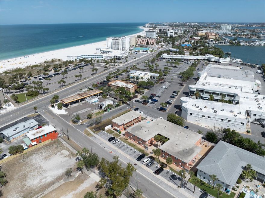 Experience the very best of Florida coastal living in this fully remodeled 2nd-floor condo, ideally located just moments from the world-renowned shores of St. Pete Beach—consistently ranked among the most beautiful and desirable beaches in the country. From your front door, simply head down the stairs and enjoy a short, effortless stroll before your toes are in the warm, powdery sand and the calm Gulf waters stretch out before you. This is everyday beach living at its finest—morning walks along the shoreline, sun-soaked afternoons, and breathtaking sunsets that never get old. Inside, the condo has been fully remodeled within the past five years, offering a fresh, modern coastal feel that is both stylish and comfortable. Major updates include a 2022 HVAC mini-split system for energy-efficient cooling and a 2023 hot water heater, providing added value and peace of mind. The space is light, inviting, and perfectly suited for full-time living, a relaxing vacation getaway, or a turnkey beach retreat. Lido Gardens is an intimate 20-unit boutique community known for its quiet charm, well-maintained grounds, and sparkling pool. One of the standout features is the private rear gate, offering owners convenient access to Dolphin Village—just steps away for everyday ease. Enjoy walkable access to shopping, dining, a grocery store, and even boat charters, making it simple to embrace the laid-back beach lifestyle without ever needing to drive. Owners also enjoy dedicated storage lockers conveniently located downstairs near the laundry room—perfect for keeping beach wagons, chairs, and all your coastal essentials ready to go. Flexible rental options add to the appeal, allowing 1-month minimum rentals up to 6 times per year—ideal for those looking to offset ownership costs or maximize seasonal demand. Even more impressive, the low HOA fee of just $500/month covers nearly everything—including water, sewer, trash, building and flood insurance, cable, and internet—leaving only electric as the owner’s responsibility. Whether you’re searching for a primary residence, a seasonal escape, this condo delivers the perfect combination of updates, location, and lifestyle in one of Florida’s most sought-after beach communities.