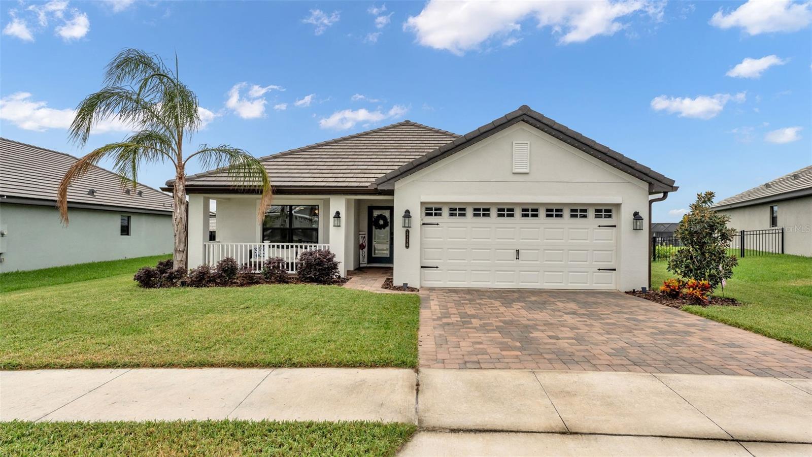Welcome to Lake Juliana Estates in Auburndale Florida! NO CDD FEE! This is a community with plenty of recreational things to do: Community Pool, Clubhouse, Fitness Center, Boat Ramp and Dock, Tennis and Pickle Ball Courts, Basket Ball Court and a Playground. The community is also Gated and has sidewalks which make it easy to do morning or afternoon walks. This community is located with easy access to I4 and the Polk Parkway for commuting. Now lets get into the house! ***
Exterior: Glass Front Door, Digital Entry on Exterior Doors, 2 car garage with Electric Vehicle Charging Plug and Smart Door Opener, MyQ Digital Garage Entry Pad, Paver Driveway, Covered Front Porch, Tile Roof, Gutters, Fenced Backyard, Screened Back Porch with Built in Fireplace and TV Mount Wall, Extended Paver Patio for BBQ, Landscaping, Double Payned Windows, Exterior Back Doors with Built in Blinds
***Interior: Wood look Tile Flooring in Main Living Area, Baths and Laundry; Luxury Vinyl Plank Flooring in all 3 Bedrooms, 5 Panel Wood Doors with Black Hardware throughout, 4 inch baseboards throughout, Stone Counter Tops throughout, Window Blinds throughout, High Ceilings throughout, Open Floorplan, Split Bedroom Plan, Inside Laundry Room, NEST Thermostat (conveys)
***Kitchen: Stainless Appliances (Refrigerator, Disposal, Microwave, Convection Oven and Midea Premium Dishwasher, Level 2 Granite Counters, Double Bowl Sink, Glass Back Splash, White Craftsman Style Cabinets with 42inch Uppers including Crown Molding, 3 Upgraded Pendant Lights, Large Island Style Bar
***Laundry Room: Built in Cabinetry over Washer and Dryer (conveys), Built in Butlers Pantry with Cabinets, Shelves and Butcher Block Counter, Wine Refrigerator (conveys) 
***Living and Dining: Two spaces for Dining include Formal Dining with Wainscot and Upgraded Chandelier and Decorative Column separating dining from living area. Large Breakfast area off the kitchen. Living has Floor to Ceiling Built in Shiplap Wall with Electric Fireplace
***Primary Bedroom: Expansive Size, Floor to Ceiling Built in Shiplap Wall with Electric Fireplace, Ceiling Fan, Exterior Door to Back Porch, New Luxury Vinyl Plank Flooring, Trey Ceiling
***Primary Bath: Dual Sinks, Level 2 Granite Counter Top, Lighted Mirrors with Anti-Fog, Garden Bath, Separate Tile Shower, Commode Room with Door, Separate Linen Closet, Long Walk-in Closet
***Guest Bedrooms: New Luxury Vinyl Flooring, Ceiling Fans, Panel Door Closets
***Guest Bath: Tile Shower, Granite Counter Top, Linen Closet in Hallway
***This home is well laid out and has so many upgrades and features already done! Value is abundant and this home is turnkey and move in ready. Start living the resort community lifestyle by calling your agent today!