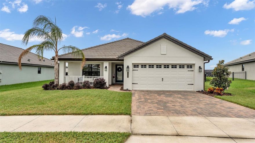 Welcome to Lake Juliana Estates in Auburndale Florida! NO CDD FEE! This is a community with plenty of recreational things to do: Community Pool, Clubhouse, Fitness Center, Boat Ramp and Dock, Tennis and Pickle Ball Courts, Basket Ball Court and a Playground. The community is also Gated and has sidewalks which make it easy to do morning or afternoon walks. This community is located with easy access to I4 and the Polk Parkway for commuting. Now lets get into the house! ***
Exterior: Glass Front Door, Digital Entry on Exterior Doors, 2 car garage with Electric Vehicle Charging Plug and Smart Door Opener, MyQ Digital Garage Entry Pad, Paver Driveway, Covered Front Porch, Tile Roof, Gutters, Fenced Backyard, Screened Back Porch with Built in Fireplace and TV Mount Wall, Extended Paver Patio for BBQ, Landscaping, Double Payned Windows, Exterior Back Doors with Built in Blinds
***Interior: Wood look Tile Flooring in Main Living Area, Baths and Laundry; Luxury Vinyl Plank Flooring in all 3 Bedrooms, 5 Panel Wood Doors with Black Hardware throughout, 4 inch baseboards throughout, Stone Counter Tops throughout, Window Blinds throughout, High Ceilings throughout, Open Floorplan, Split Bedroom Plan, Inside Laundry Room, NEST Thermostat (conveys)
***Kitchen: Stainless Appliances (Refrigerator, Disposal, Microwave, Convection Oven and Midea Premium Dishwasher, Level 2 Granite Counters, Double Bowl Sink, Glass Back Splash, White Craftsman Style Cabinets with 42inch Uppers including Crown Molding, 3 Upgraded Pendant Lights, Large Island Style Bar
***Laundry Room: Built in Cabinetry over Washer and Dryer (conveys), Built in Butlers Pantry with Cabinets, Shelves and Butcher Block Counter, Wine Refrigerator (conveys) 
***Living and Dining: Two spaces for Dining include Formal Dining with Wainscot and Upgraded Chandelier and Decorative Column separating dining from living area. Large Breakfast area off the kitchen. Living has Floor to Ceiling Built in Shiplap Wall with Electric Fireplace
***Primary Bedroom: Expansive Size, Floor to Ceiling Built in Shiplap Wall with Electric Fireplace, Ceiling Fan, Exterior Door to Back Porch, New Luxury Vinyl Plank Flooring, Trey Ceiling
***Primary Bath: Dual Sinks, Level 2 Granite Counter Top, Lighted Mirrors with Anti-Fog, Garden Bath, Separate Tile Shower, Commode Room with Door, Separate Linen Closet, Long Walk-in Closet
***Guest Bedrooms: New Luxury Vinyl Flooring, Ceiling Fans, Panel Door Closets
***Guest Bath: Tile Shower, Granite Counter Top, Linen Closet in Hallway
***This home is well laid out and has so many upgrades and features already done! Value is abundant and this home is turnkey and move in ready. Start living the resort community lifestyle by calling your agent today!