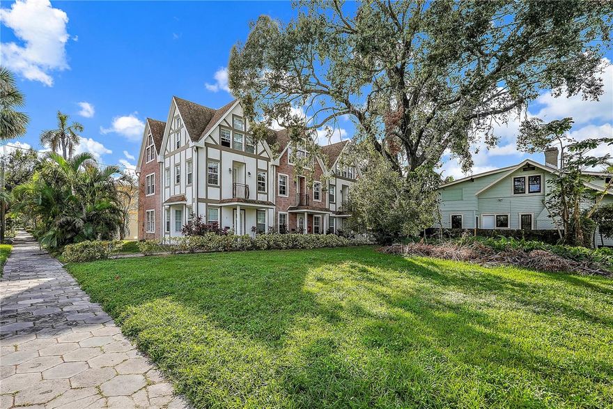 Move-in Ready! Location is everything and this one delivers. Just two blocks from downtown St. Petersburg and Beach Drive, this beautifully maintained 3-bedroom, 2.5-bath townhome is tucked inside a private enclave of only three French Colonial–style residences built in 2009. A rare offering in the highly sought-after Historic Old Northeast, complete with a rear-entry 2-car garage. Inside, stone tile and wood flooring run throughout, pairing timeless character with modern comfort. The top-floor primary suite is a true retreat, featuring a dramatic Swiss Chalet–inspired vaulted ceiling, a custom walk-through closet with built-ins, and a spa-like bath with dual vanities, granite countertops, a jetted soaking tub, and a walk-in shower. The thoughtfully designed layout places the garage, living room, and half bath on the first floor, while the second level hosts the kitchen, two additional bedrooms, and a full bath. The kitchen is outfitted with granite countertops, wood cabinetry, and stainless steel appliances ideal for everyday living or entertaining. Outdoor spaces include a private, fenced garden patio and a charming second-floor balcony with pleasant views. Enjoy an exceptionally walkable lifestyle just steps from North Straub Park, North Shore Dog Park, Vinoy Park, and all the dining, shopping, and waterfront attractions downtown St. Pete has to offer. Also conveniently located near USF St. Petersburg. A perfect blend of location, style, and livability in one of the city’s most desirable neighborhoods.